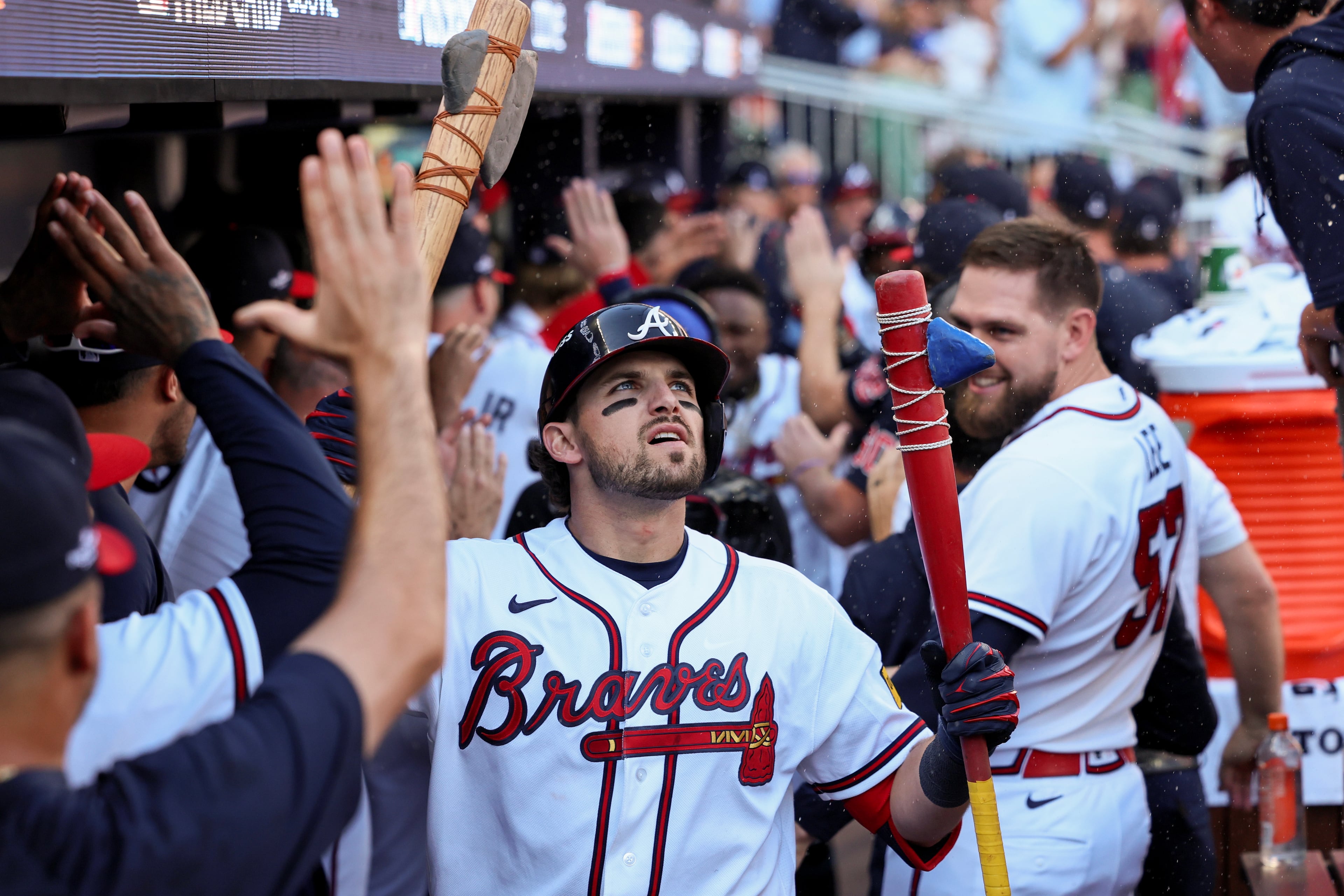 Atlanta Braves' Austin Riley celebrates in the dugout after hitting a three-run home run against the Philadelphia Phillies during the eighth inning of Game 1 of a MLB National League Wild Card playoff series between the Atlanta Braves and the Philadelphia Phillies, Tuesday, Sept. 29, 2026, in Atlanta.. (Jason Getz/AJC)