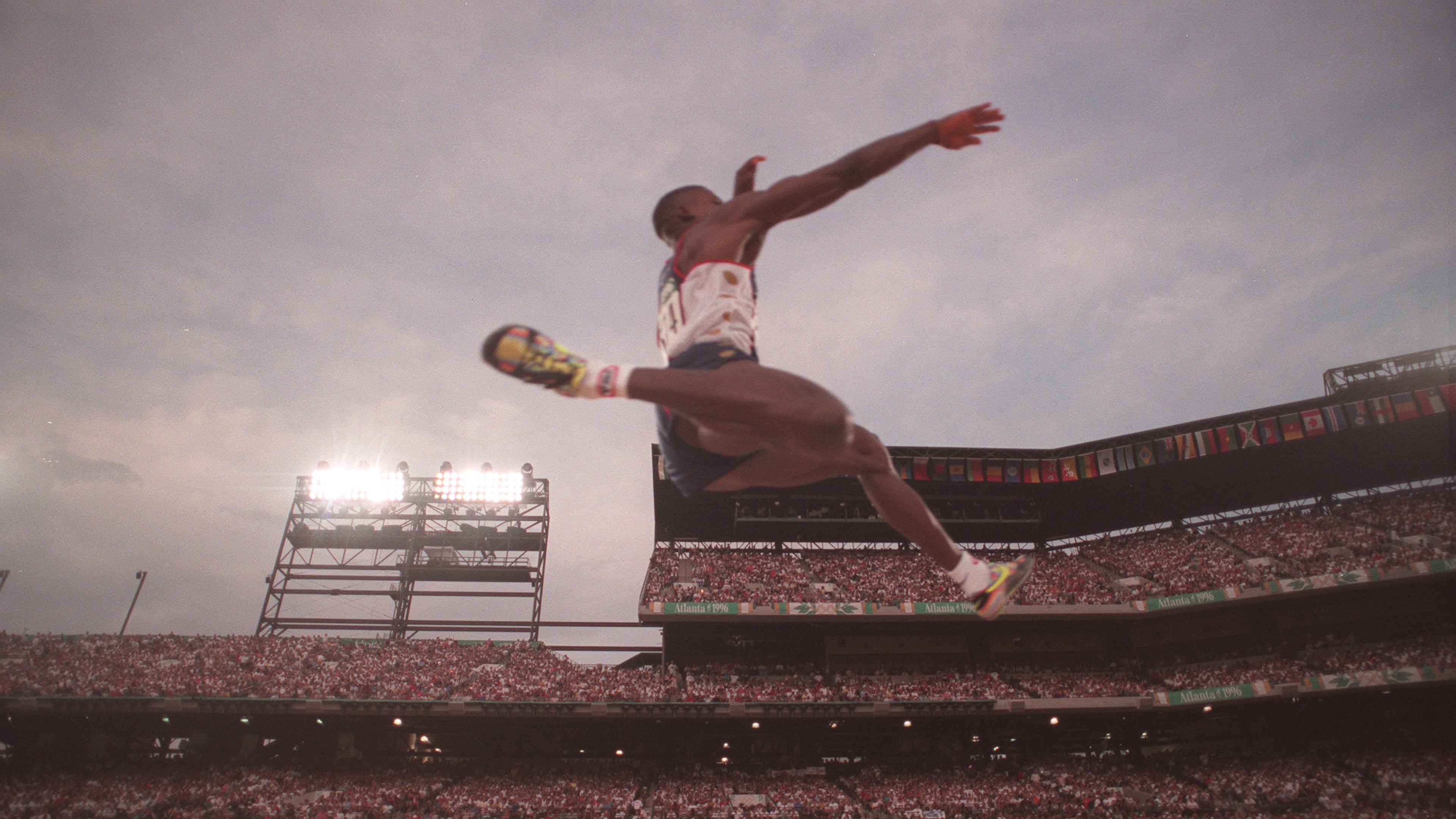 35-year-old Carl Lewis soared to the gold medal in the long jump at the 1996 Olympics in Atlanta. Lewis also won the event in the 1984, 1988 and 1992 Games. (Rich Addicks/AJC 1996)