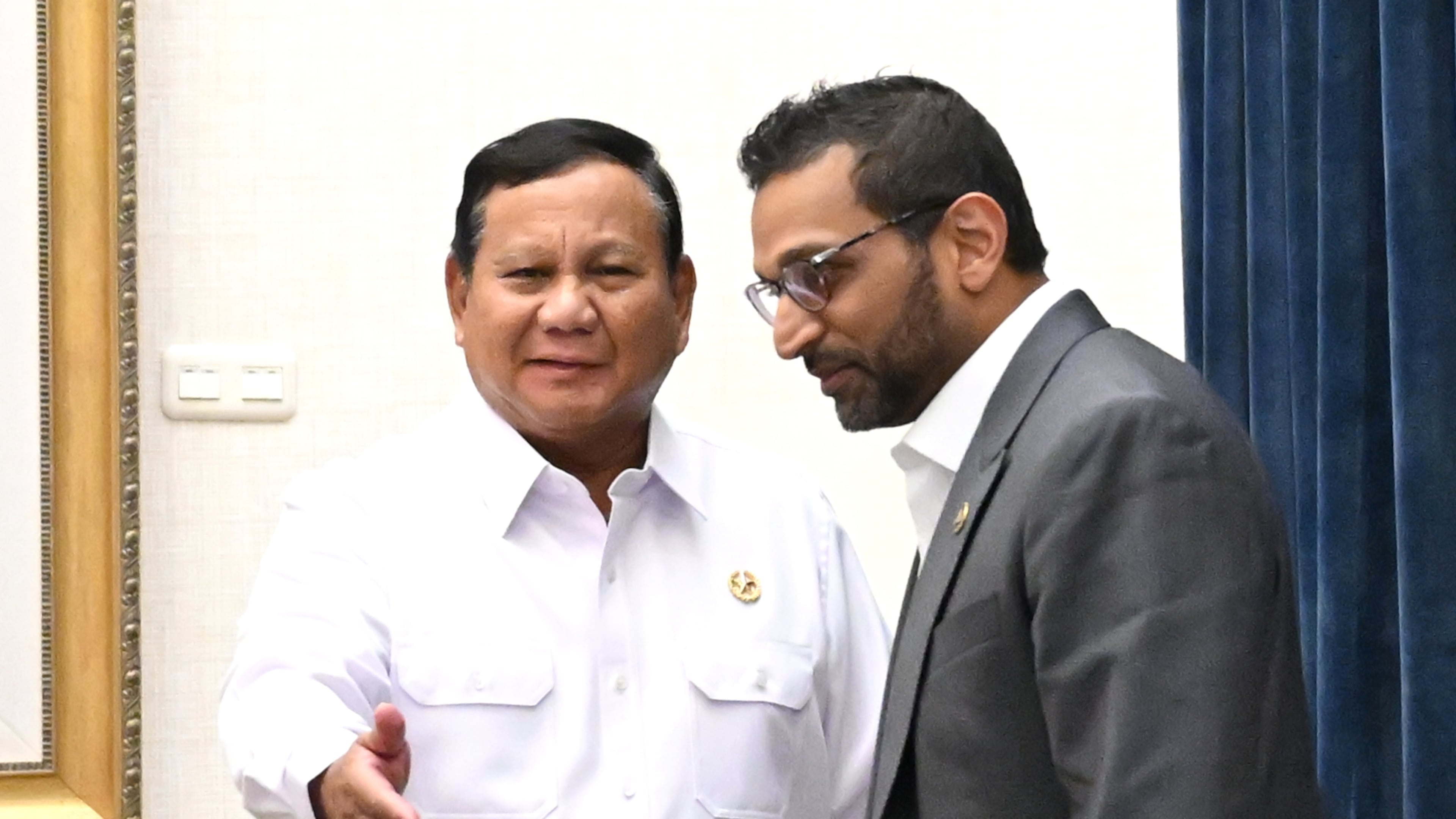 In this photo released by the Press, Media and Information Bureau of the Indonesian Presidential Secretariat, Indonesian President Prabowo Subianto, left, talks with FBI Director Kash Patel during their meeting in Jakarta, Indonesia, Wednesday, July 22, 2026. (Indonesian Presidential Secretariat via AP)