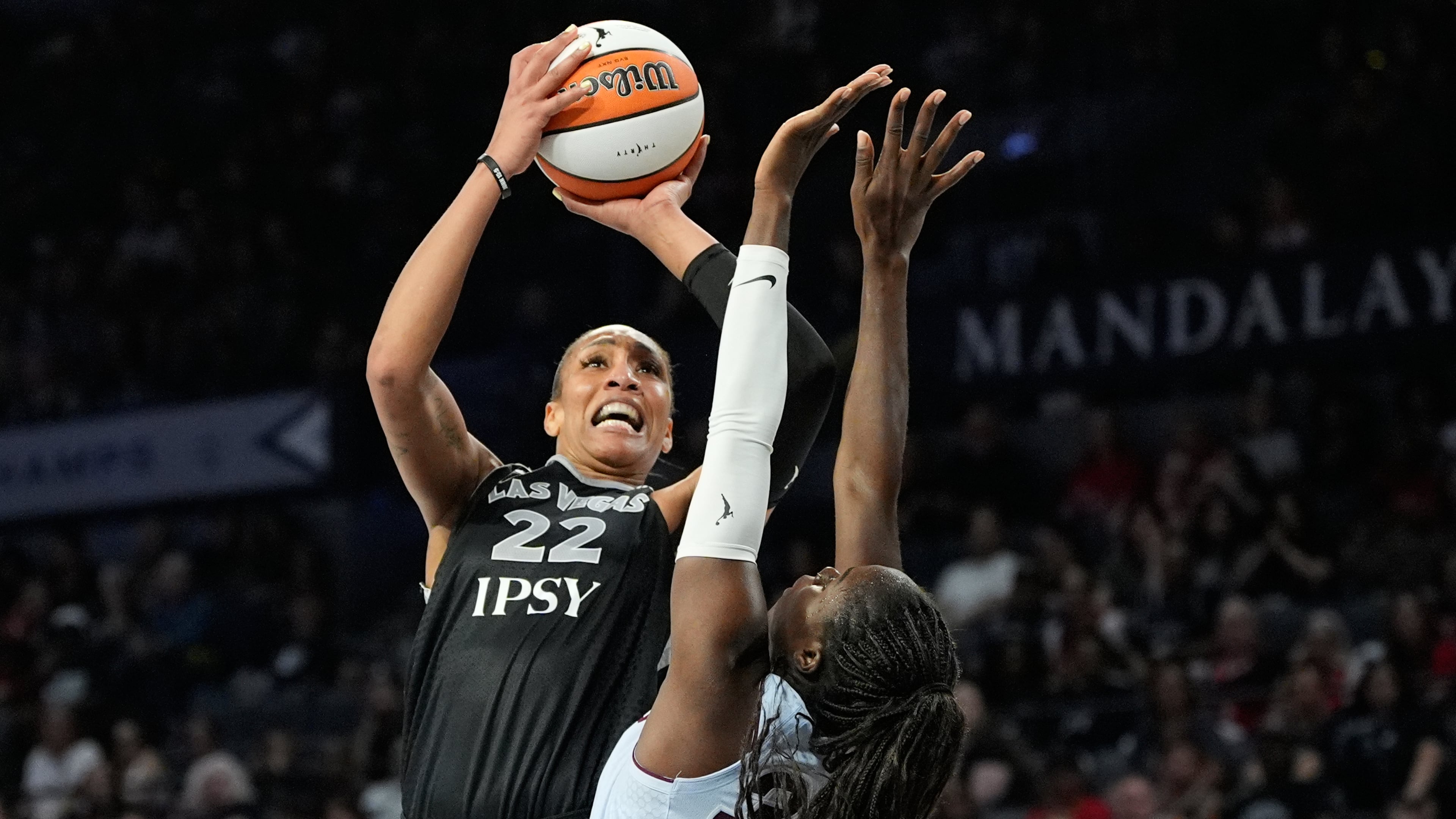 Las Vegas Aces center A'ja Wilson (22) shoots over Toronto Tempo guard Ornella Bankole (33) during the second half of a WNBA basketball game Friday, Aug. 28, 2026, in Las Vegas. (AP Photo/John Locher)