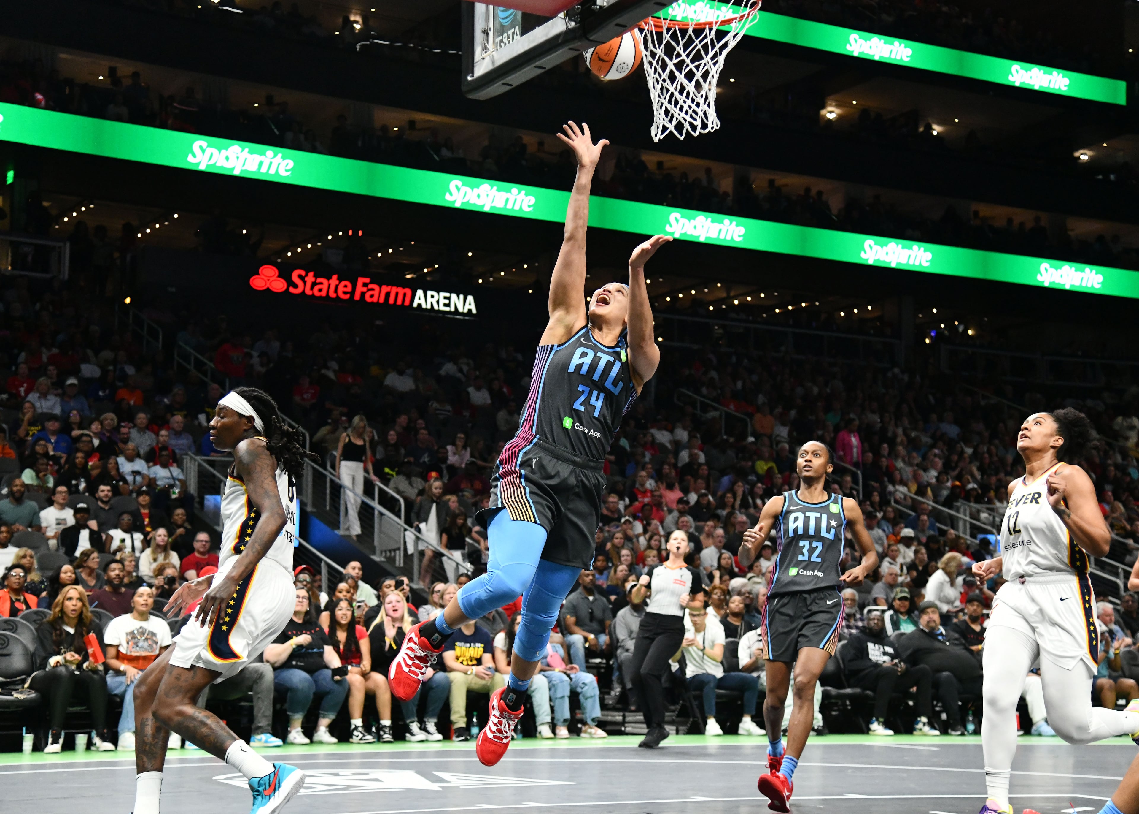 Atlanta Dream forward Brionna Jones (24) goes to the basket for the shot during the first half in Atlanta Dream’s home opener at State Farm Arena, Thursday, May 22, 2025, in Atlanta. (Hyosub Shin / AJC)
