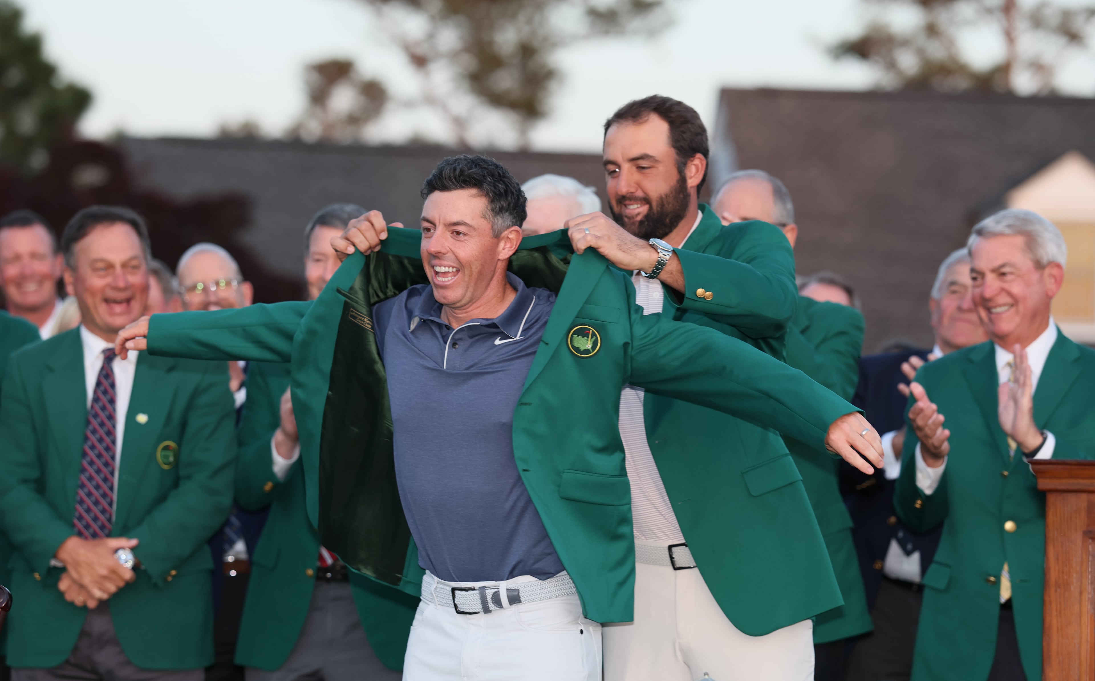 Jon Rahm, 2024 Masters champion, places green jacket on 2025 winner Rory McIlroy at Augusta National Golf Club, Sunday, April 13, 2025, in Augusta, Ga. (Hyosub Shin / AJC)