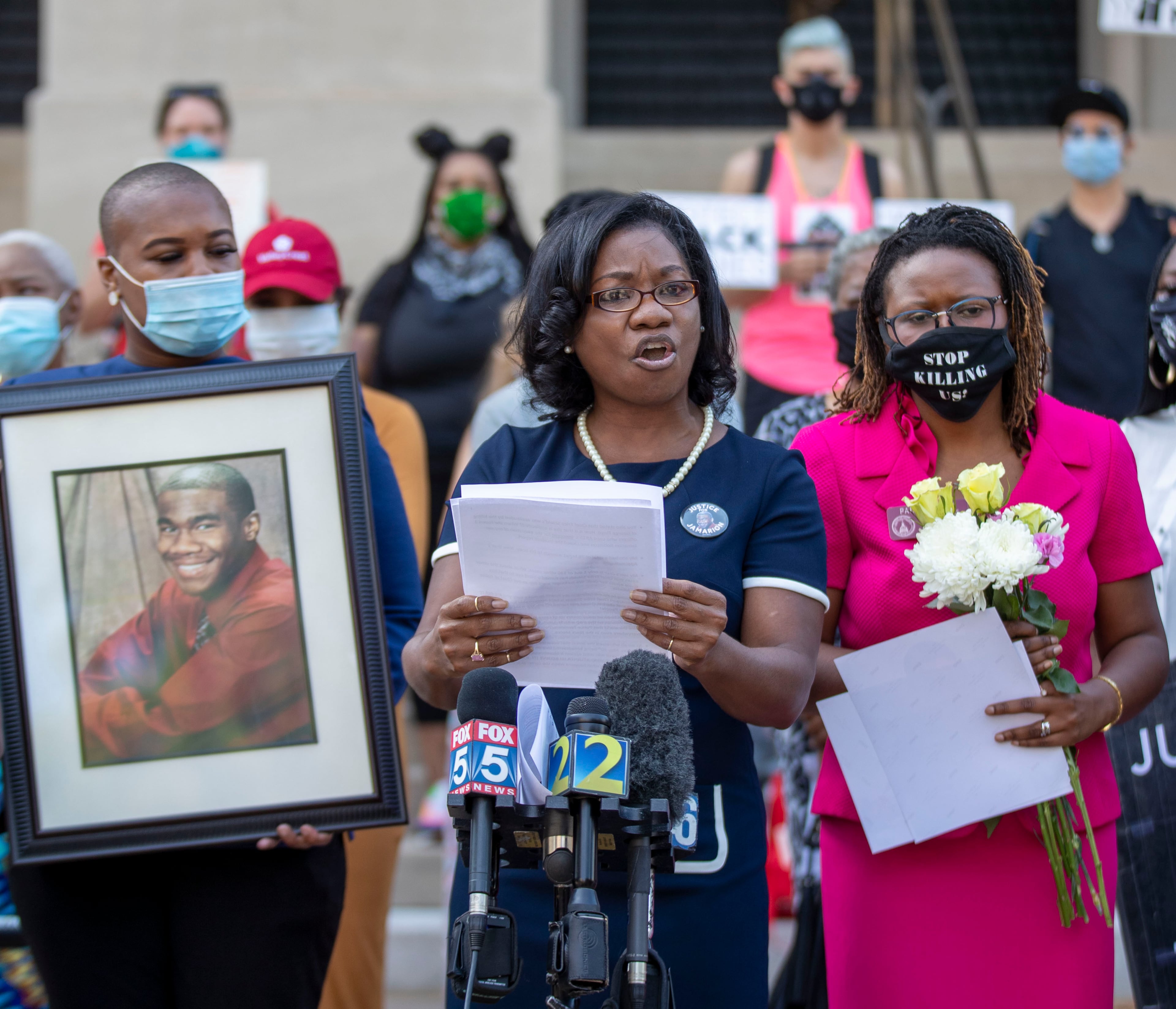 06/02/2020 - Atlanta, Georgia - Georgia State Legislators Erica Thomas (D-Austell) (left) and Park Cannon (right) (D-Atlanta) stand in solidarity with Monteria Robinson as she speaks about her late son, Jamarion Robinson, during a press conference on the steps of the Georgia State Capitol Building in Atlanta, Tuesday, June 2, 2020. Jamarion Robinson, 26, who had played football at Clark Atlanta University and struggled with schizophrenia, was shot by officers more than 50 times on Aug. 5, 2016. The officers with several metro agencies and U.S. Marshals were trying to serve an arrest warrant on Robinson for allegedly firing a gun at officers in a previous encounter. Monteria was seeking justice for her sons death. The press conference was hosted by several local Democratic legislatures who were showing support for mother's who that are seeking justice for the deaths of their sons by police officers. The legislatures spoke about HB HB 636 or the Use of Force Data Collection Act. (ALYSSA POINTER / ALYSSA.POINTER@AJC.COM)