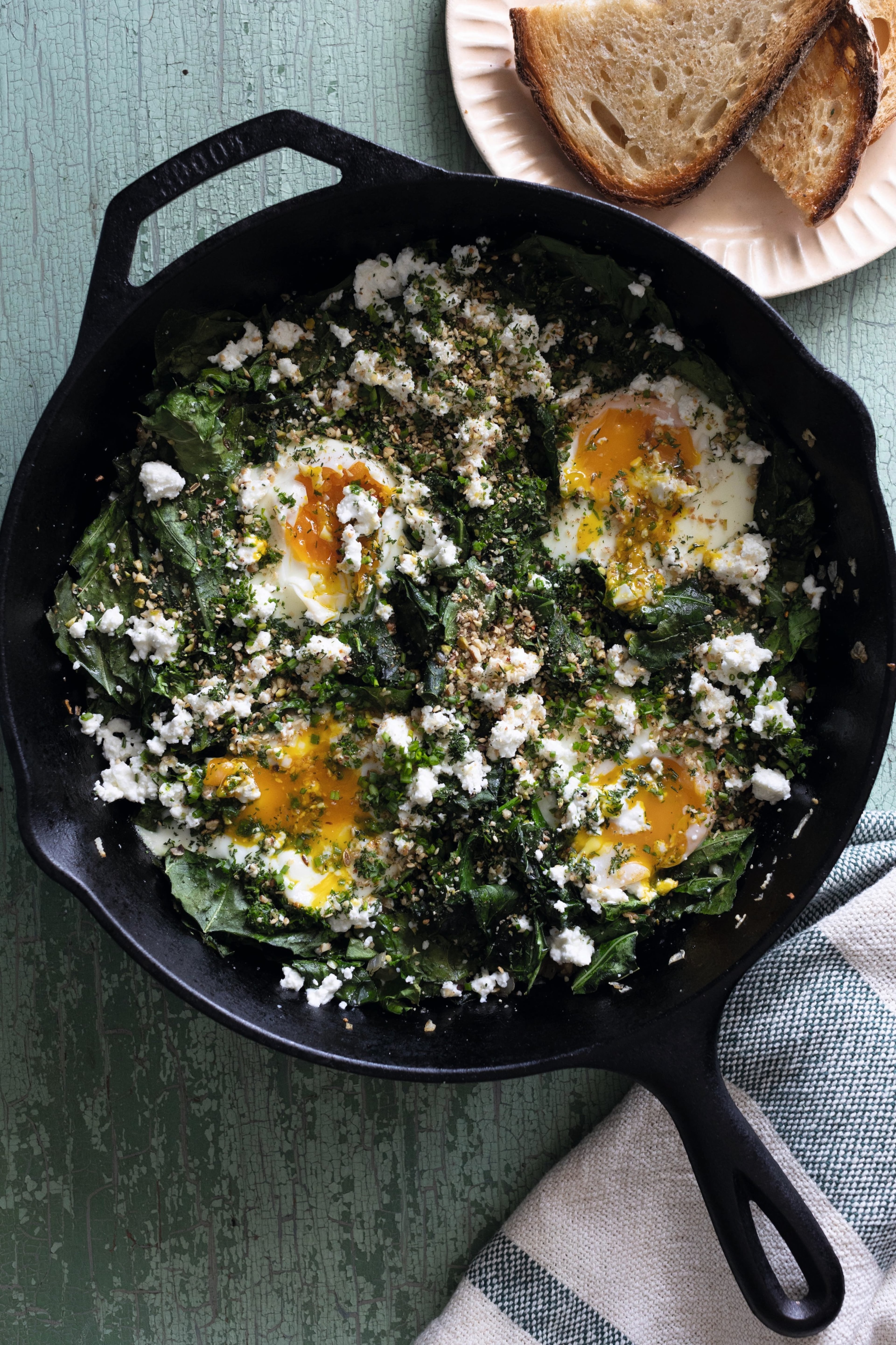 The recipe for Collard Green Shakshuka with Pecan Dukkah comes from chef Suzanne Vizethann's home kitchen. (Courtesy of Kelly Berry/Gibbs Smith Books)