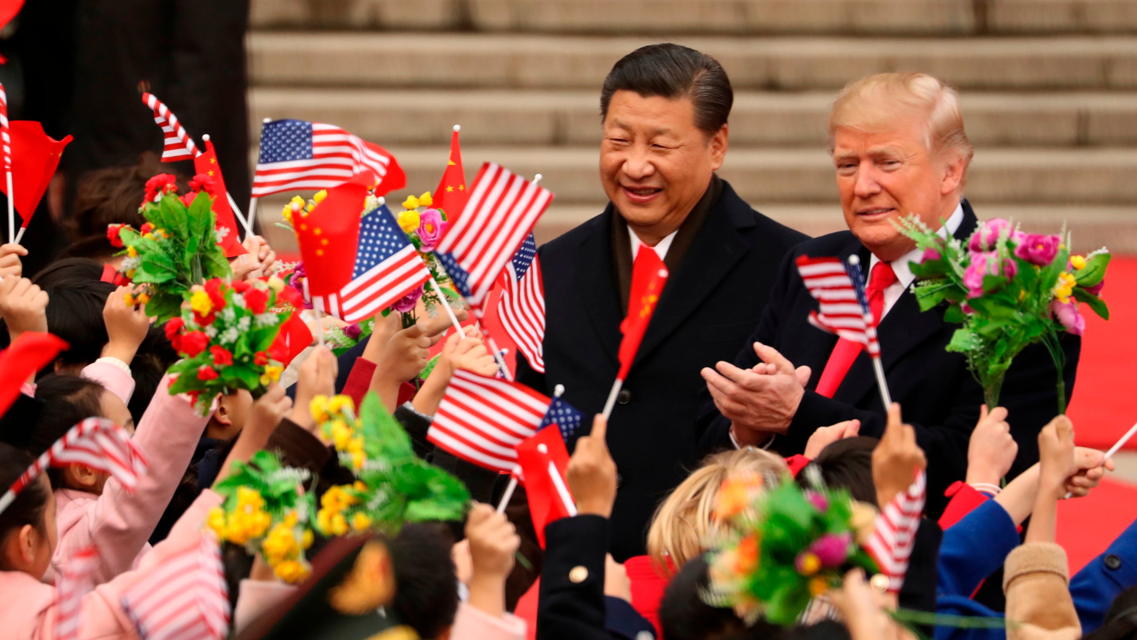 FILE - President Donald Trump and Chinese President Xi Jinping participate in a welcome ceremony at the Great Hall of the People in Beijing, China, Nov. 9, 2017. (AP Photo/Andrew Harnik, File)