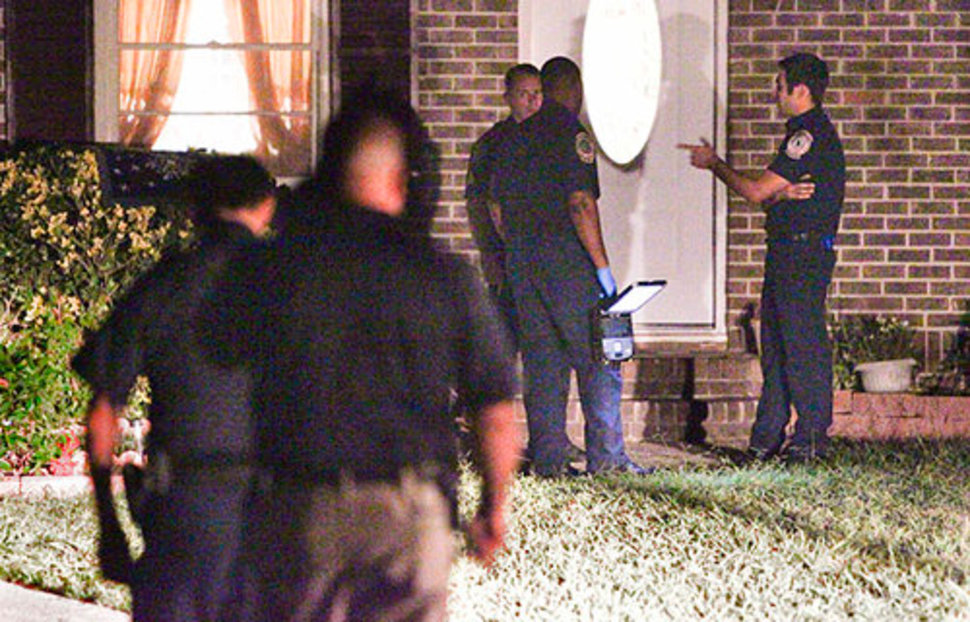 Authorities assess the situation early Monday morning at the scene.