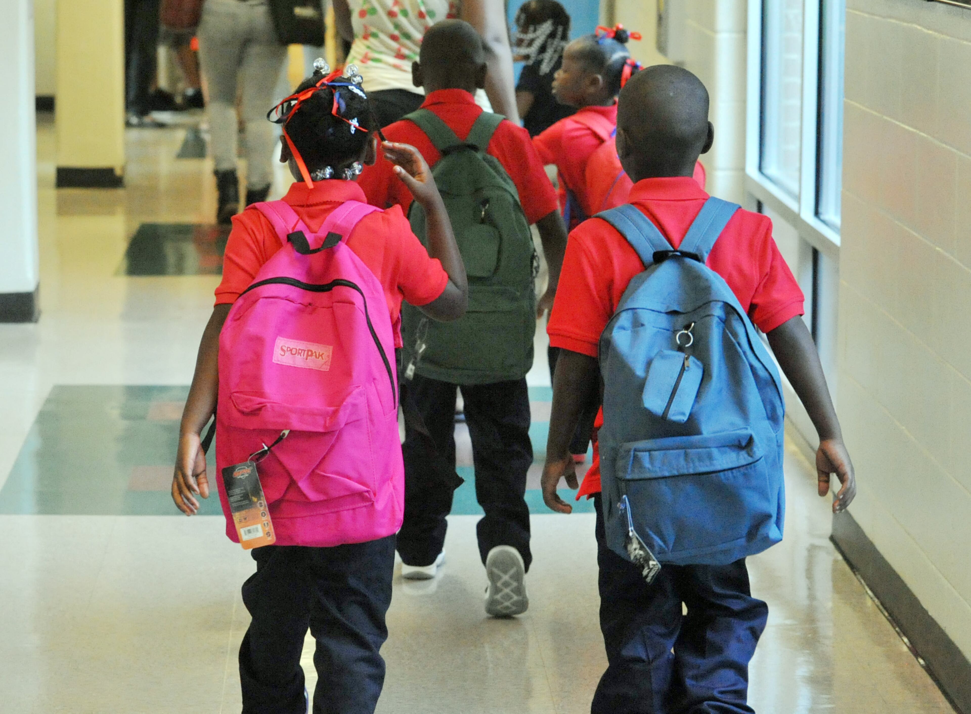 Students walk to classes as they start back to school at Bethune Elementary School in Atlanta on the first day of classes, Monday August 4, 2014. APS Superintendent Meria Carstarphen greeted students, parents, faculty and staff during the morning. KENT D. JOHNSON/KDJOHNSON@AJC.COM