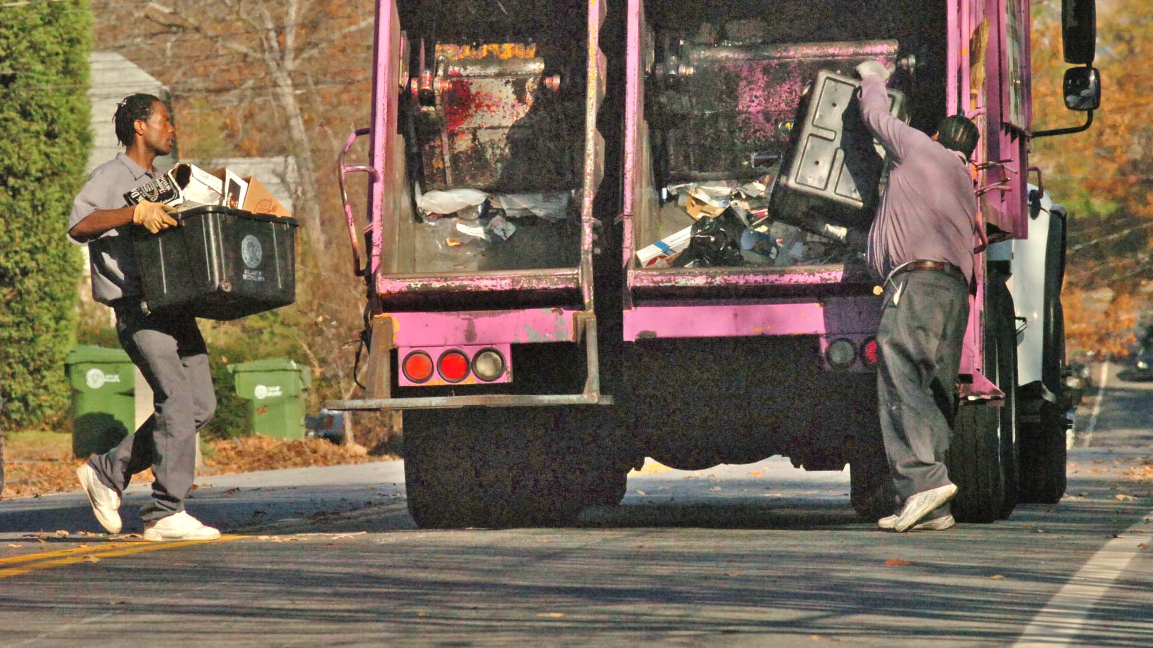 Sanitation workers pick up recyclable materials in Atlanta’s Candler Park/Inman Park area. Atlanta-based waste disposal technology firm Rubicon is helping the city gauge the impact of its recycling efforts with new mobile technology that collects varioius data on recyling while garbage trucks are on their routes. AJC File Photo