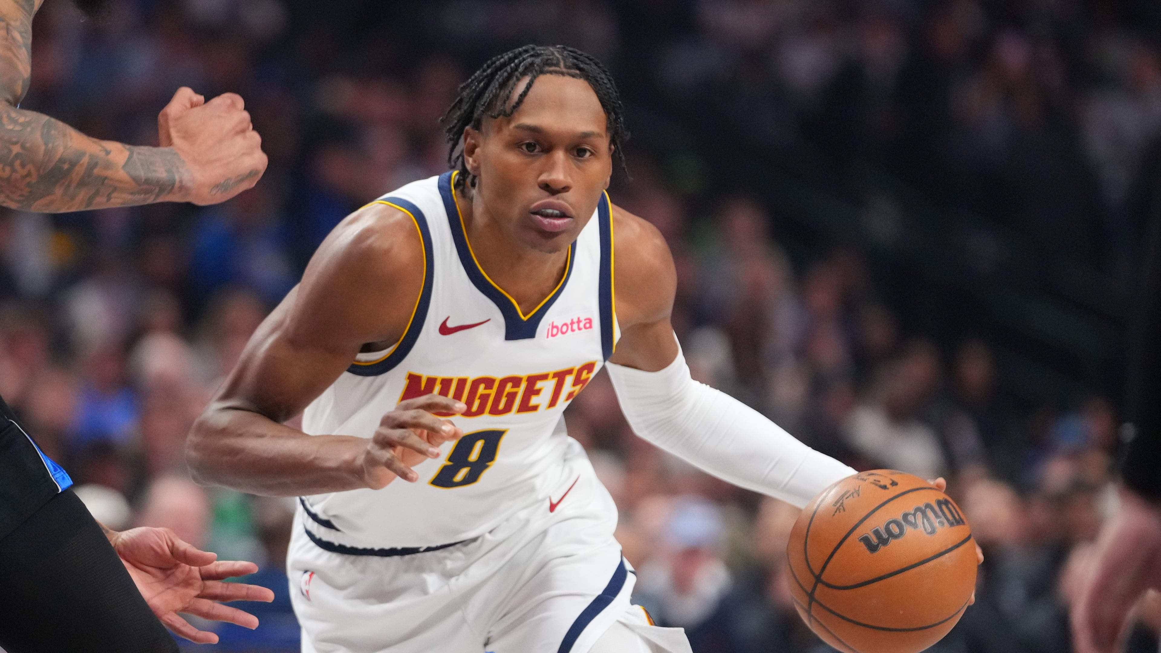 FILE - Denver Nuggets guard Peyton Watson (8) drives to the basket during the first half of an NBA basketball game between the Dallas Mavericks and the Denver Nuggets, on Jan. 14, 2026, in Dallas. (AP Photo/Julio Cortez, File)