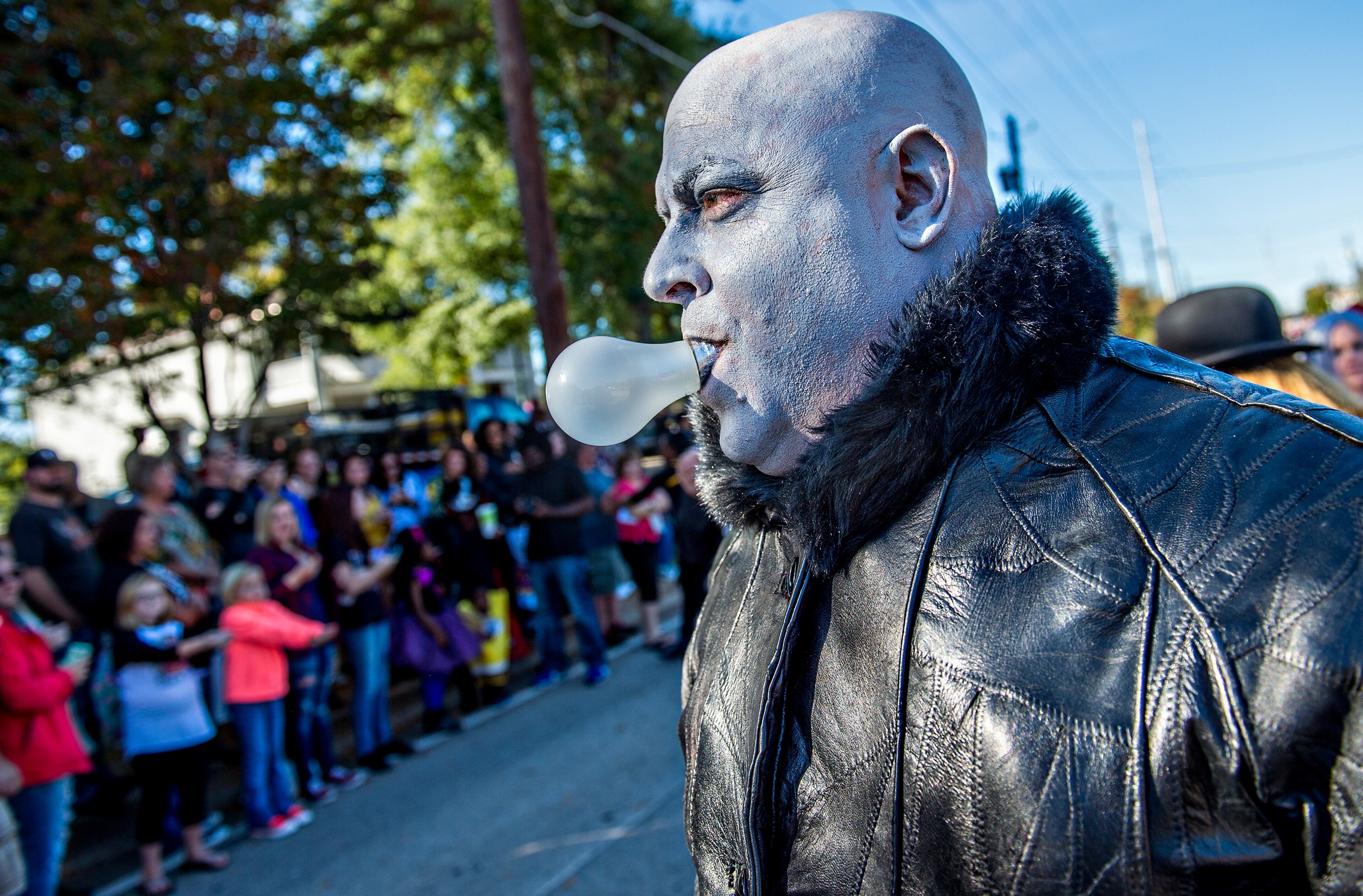 October 17, 2015 Atlanta - Dressed as Uncle Fester from the Addams Family, Arthur Morrison carries a lightbulb in his mouth during the Little Five Points Halloween Parade in Atlanta on Saturday, October 17, 2015. The annual parade brought out tens of thousands of people to watch the antics. JONATHAN PHILLIPS / SPECIAL