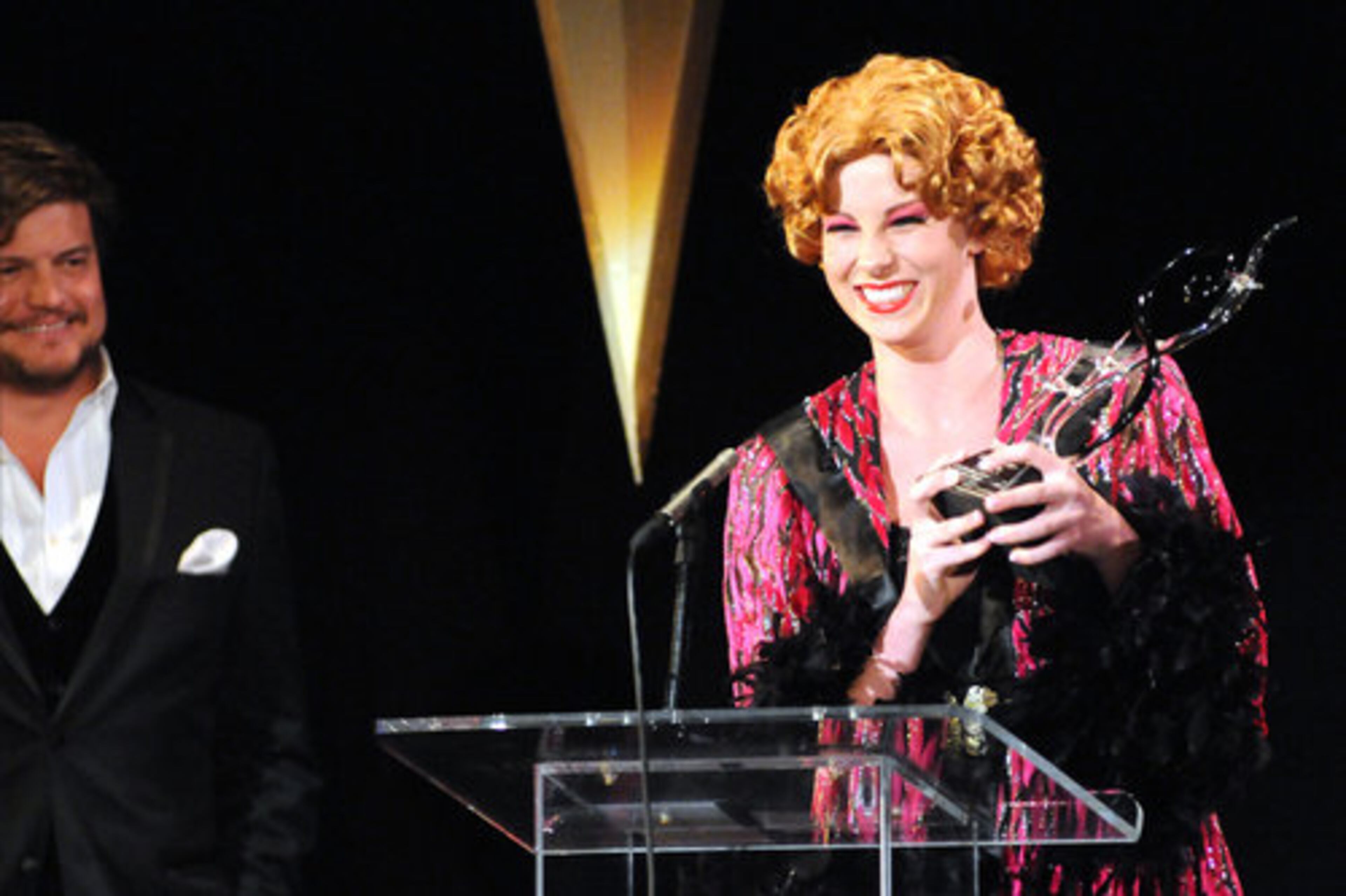 Erin Borain of Alpharetta High School accepts the Shuler Hensley Award for Leading Actress for her portrayal of Ms. Adelaide in "Guys and Dolls." At left is presenter Rob Evan.