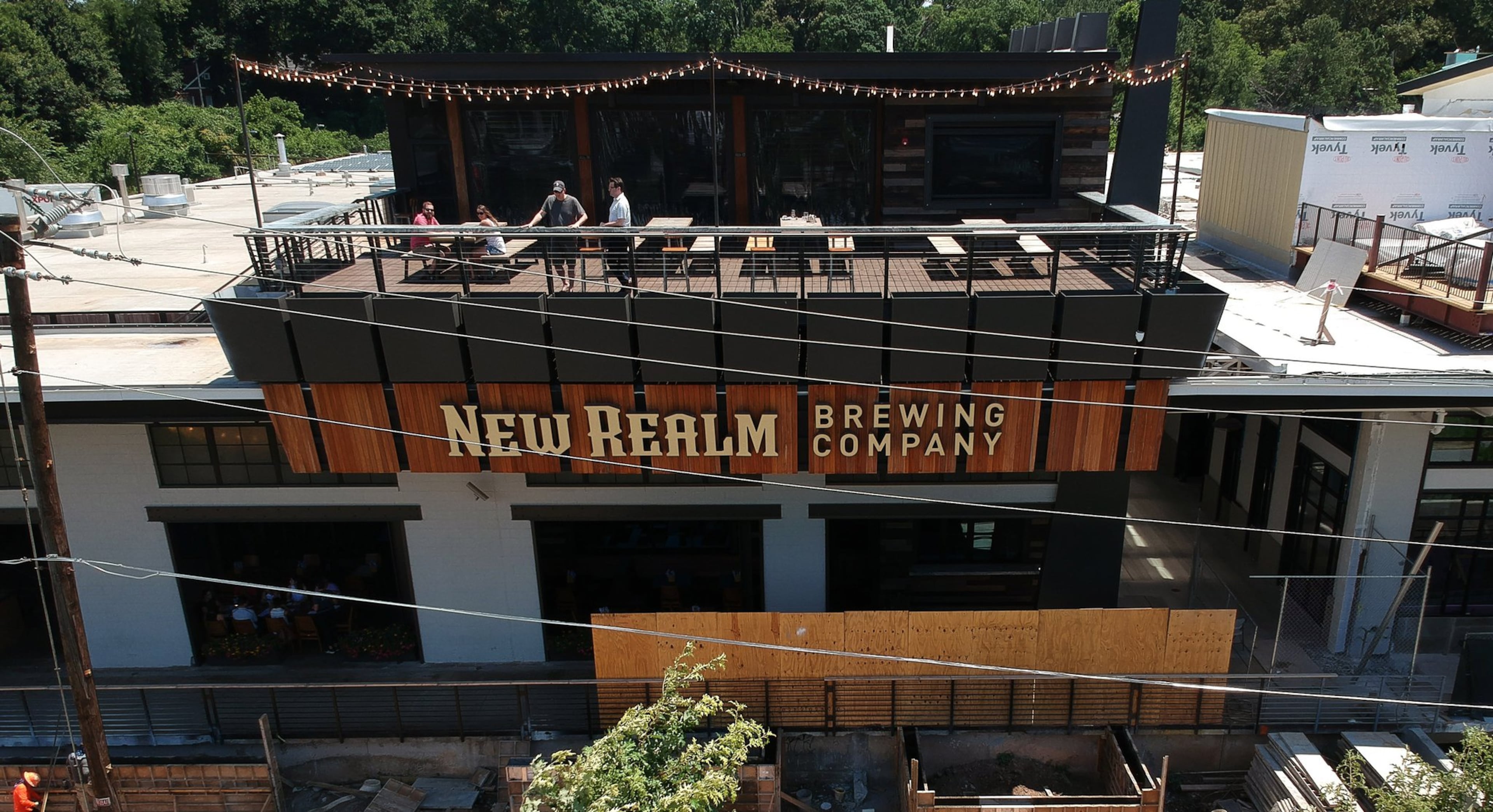 New Realm Brewing Co. is known for its rooftop bar that looks out over the Beltline. (Steve Schaefer for the AJC)