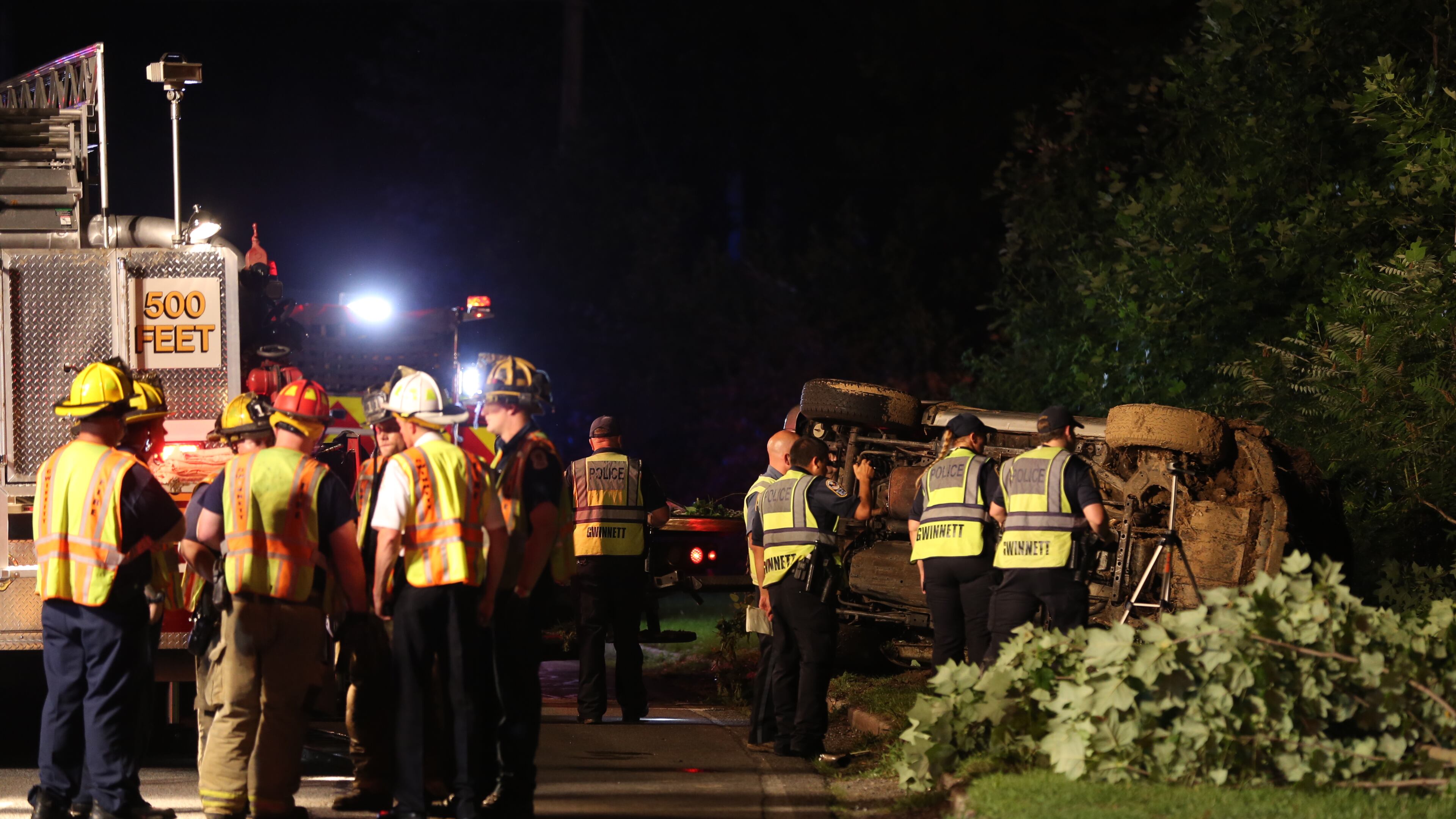 Gwinnett County authorities were on the scene after a car was found submerged in a marshy pond on Thursday, June 11, 2015. (BEN GRAY / BGRAY@AJC.COM)