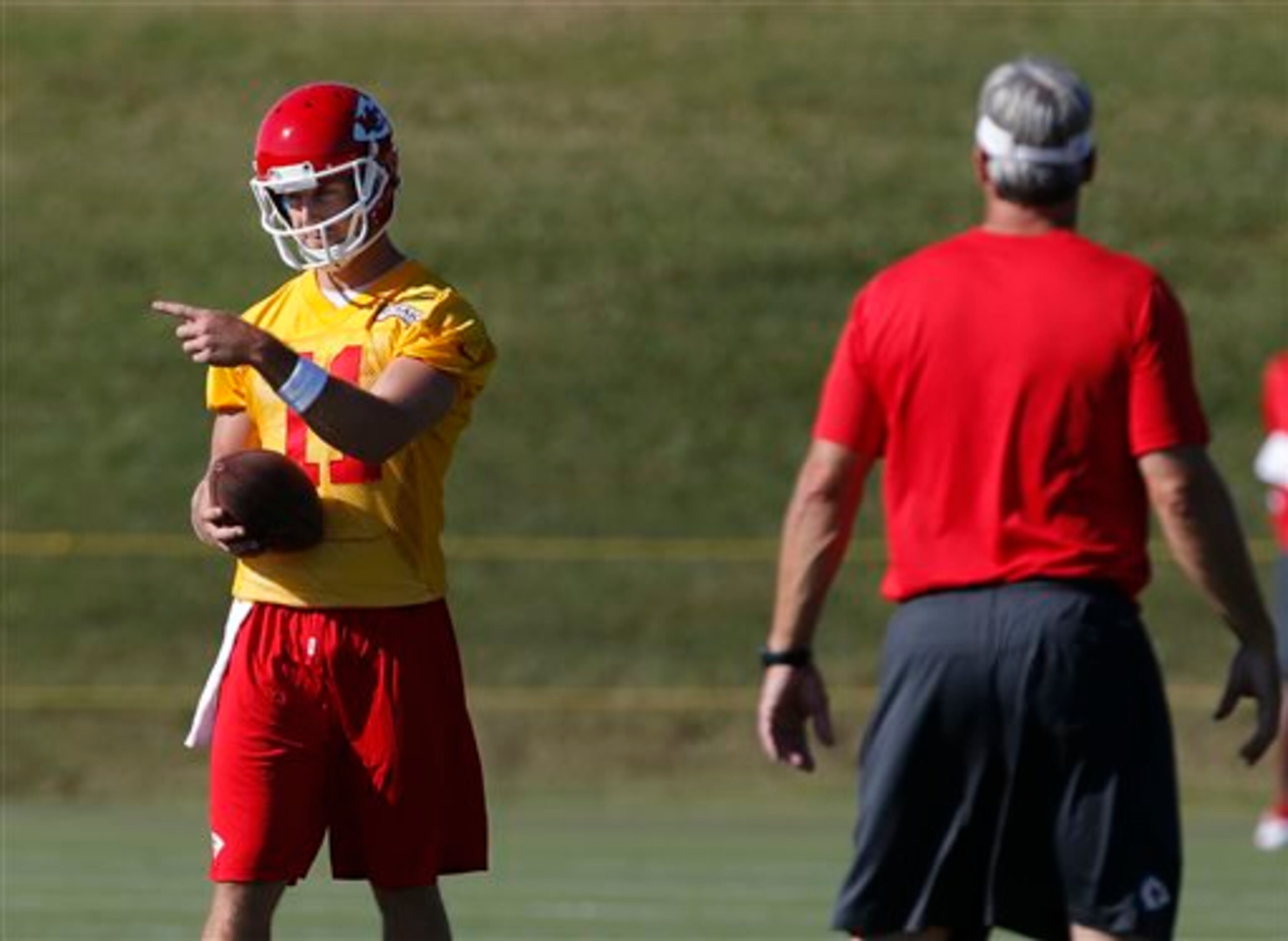 Kansas City Chiefs quarterback Alex Smith (11) directs a teammate during NFL football training camp in St. Joseph, Mo., Wednesday, July 24, 2013. (AP Photo/Orlin Wagner)