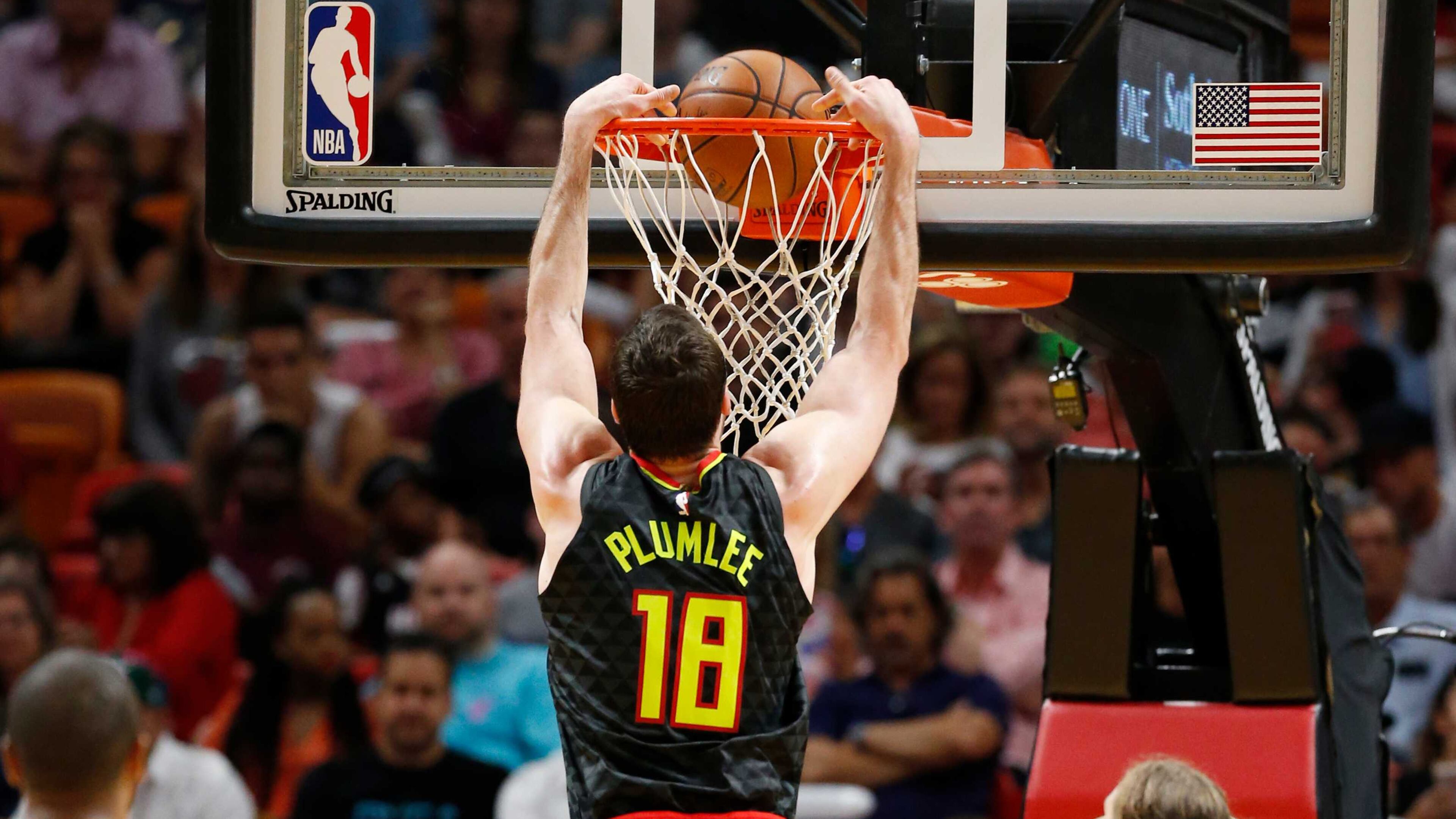 Hawks center Miles Plumlee (18) dunks during the first half of the team's NBA basketball game against the Miami Heat, Tuesday, April 3, 2018, in Miami. (AP Photo/Wilfredo Lee)