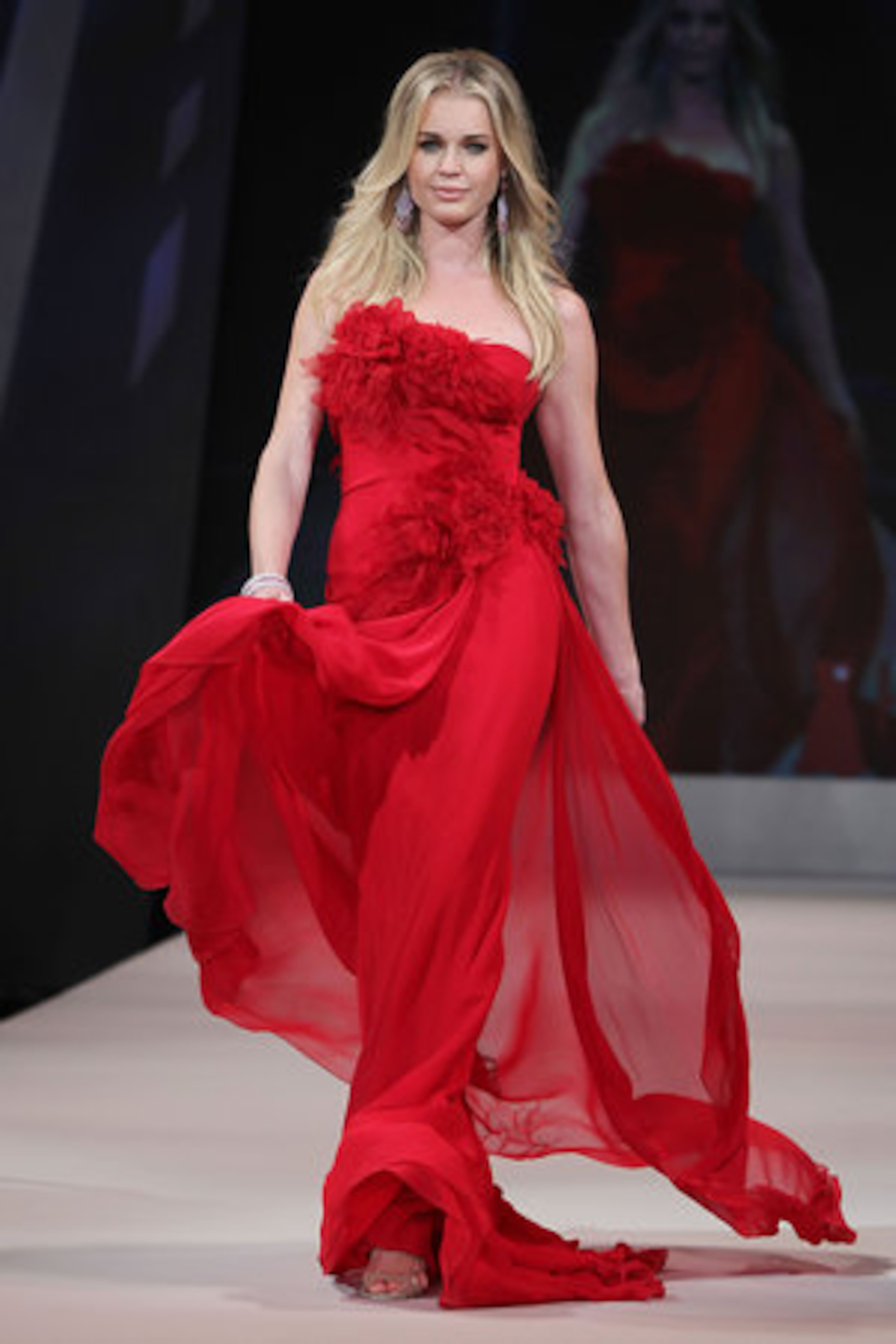 Former model and actress Rebecca Romijn models Marchesa.