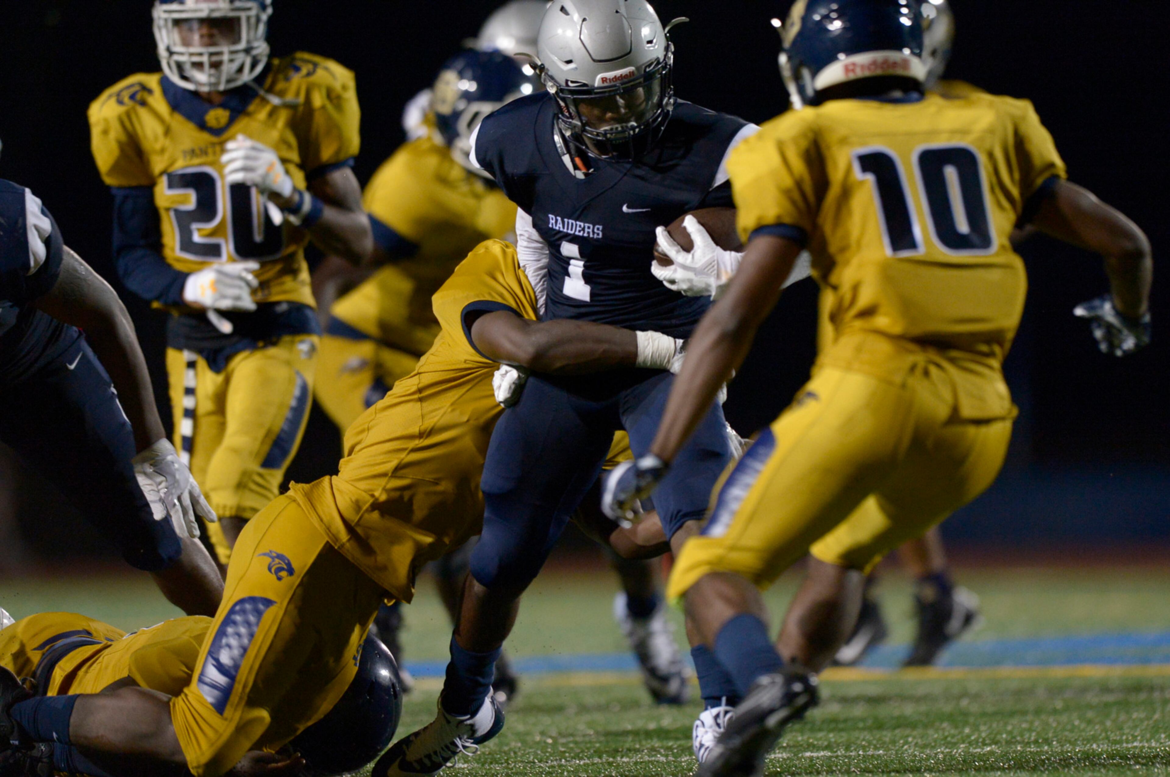Redan senior RB Eian Scott (1) gains yardage during the second half of a football game against Southwest Dekalb at Buck Godfrey Stadium in Decatur Friday, August 18, 2017.