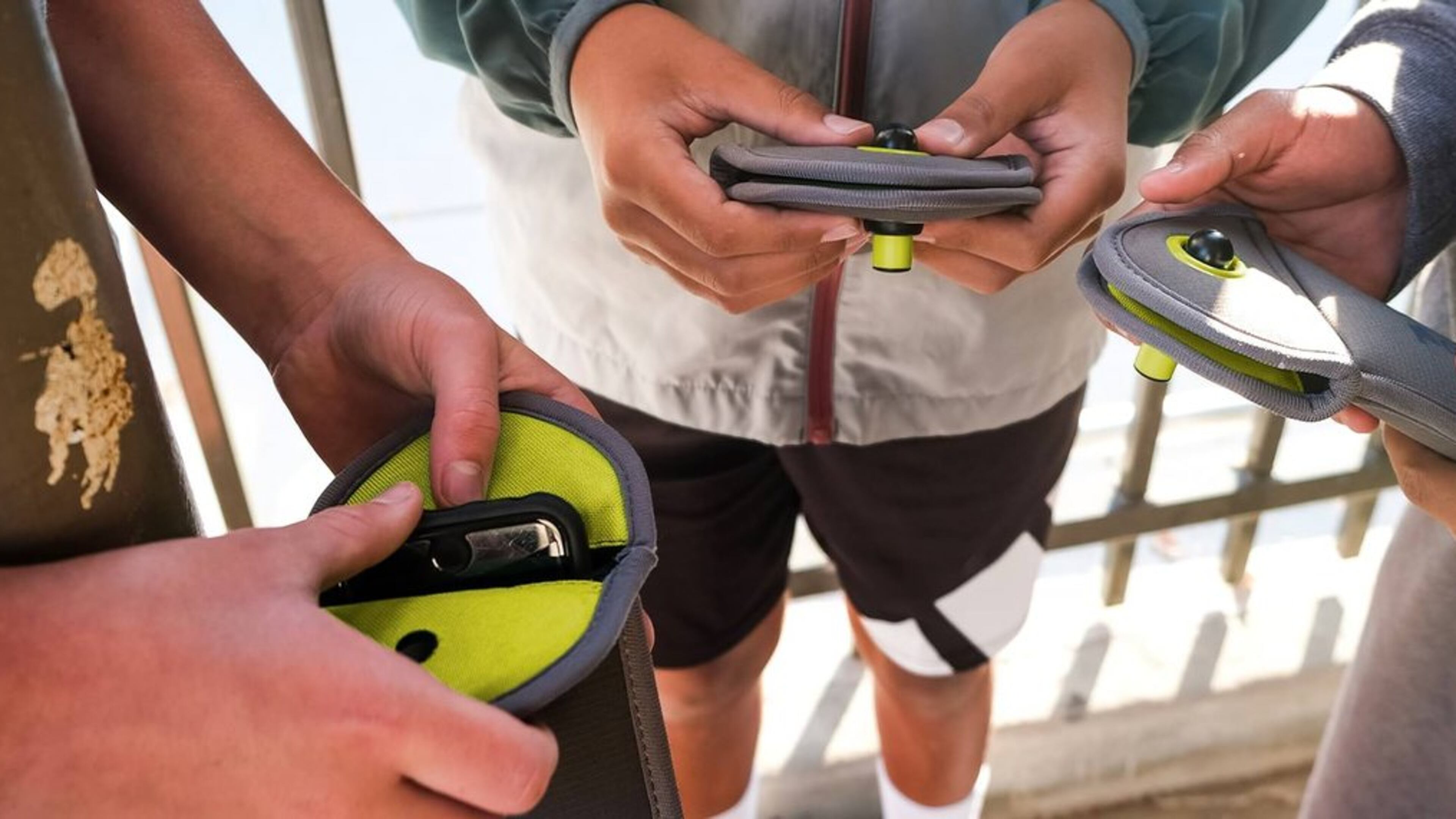 Students put their phones in Yondr pouches, which are designed to keep students from accessing their devices during class time. Several Georgia schools, including some in DeKalb, will try out the pouches this year. (Courtesy of Yondr)