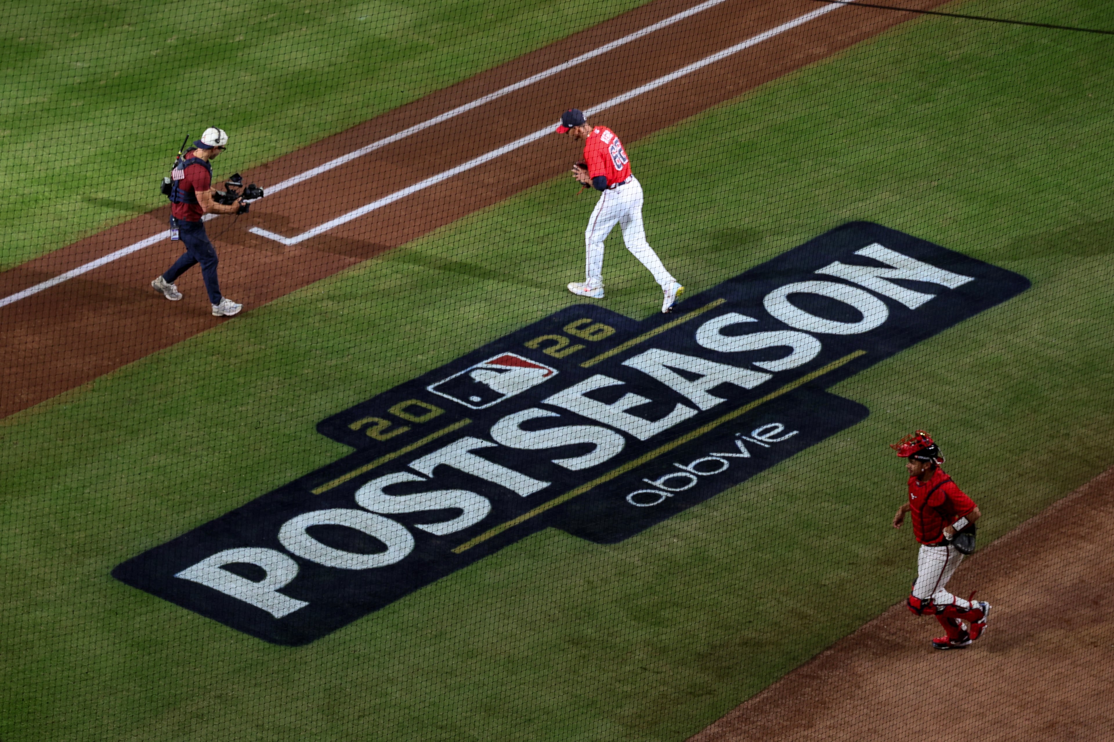 Atlanta Braves pitcher Ray Kerr (62) and catcher Drake Baldwin (30) walk onto the field to start the first inning of Game 3 of a MLB National League Wild Card playoff series between the Atlanta Braves and the Philadelphia Phillies, Thursday, Oct. 1, 2026, in Atlanta. (Jason Getz/AJC)