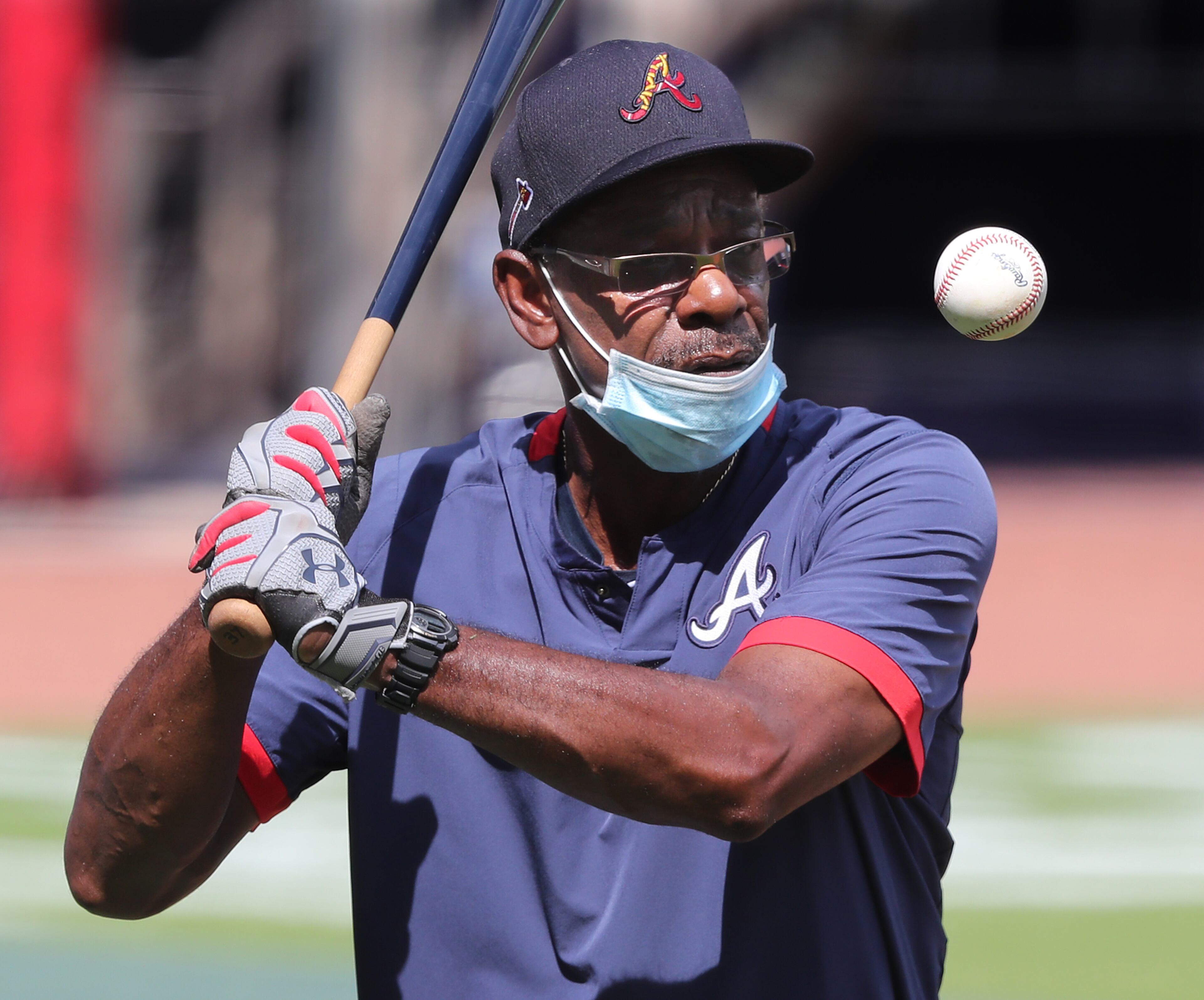 Braves third base coach Ron Washington works with players during batting practice before playing the Tampa Bay Rays Thursday, July 30, 2020, at Truist Park in Atlanta.