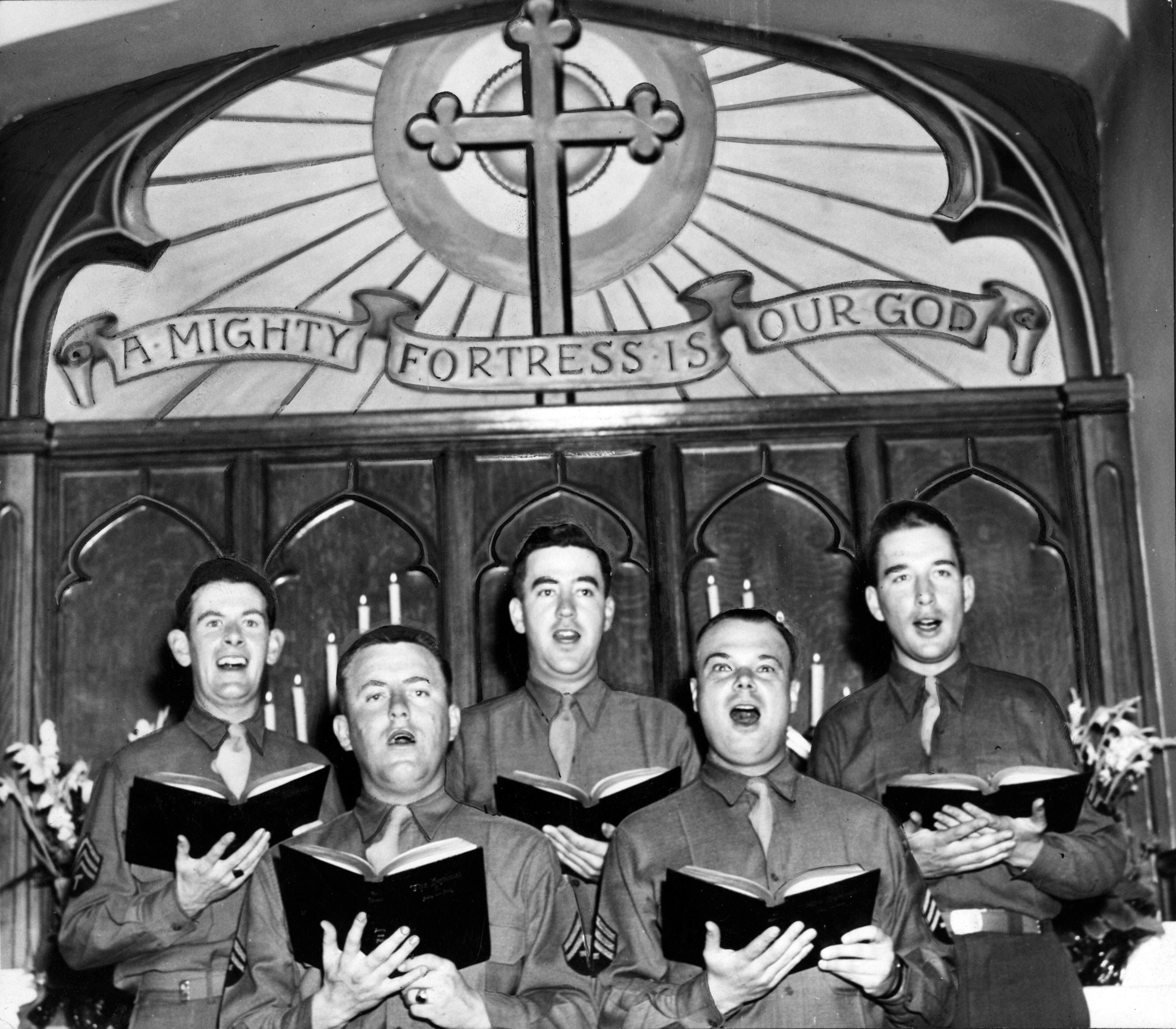 April 25, 1943 -- The III Corps choir of Fort Mac sang at the morning's Easter Service. Left to right are Sergeant Edward J. Sullivan, Corporal Jake Streeter, Corporal Joseph Gunn, Sergeant George K. Rogers and Sergeant Frank Thiebaut.