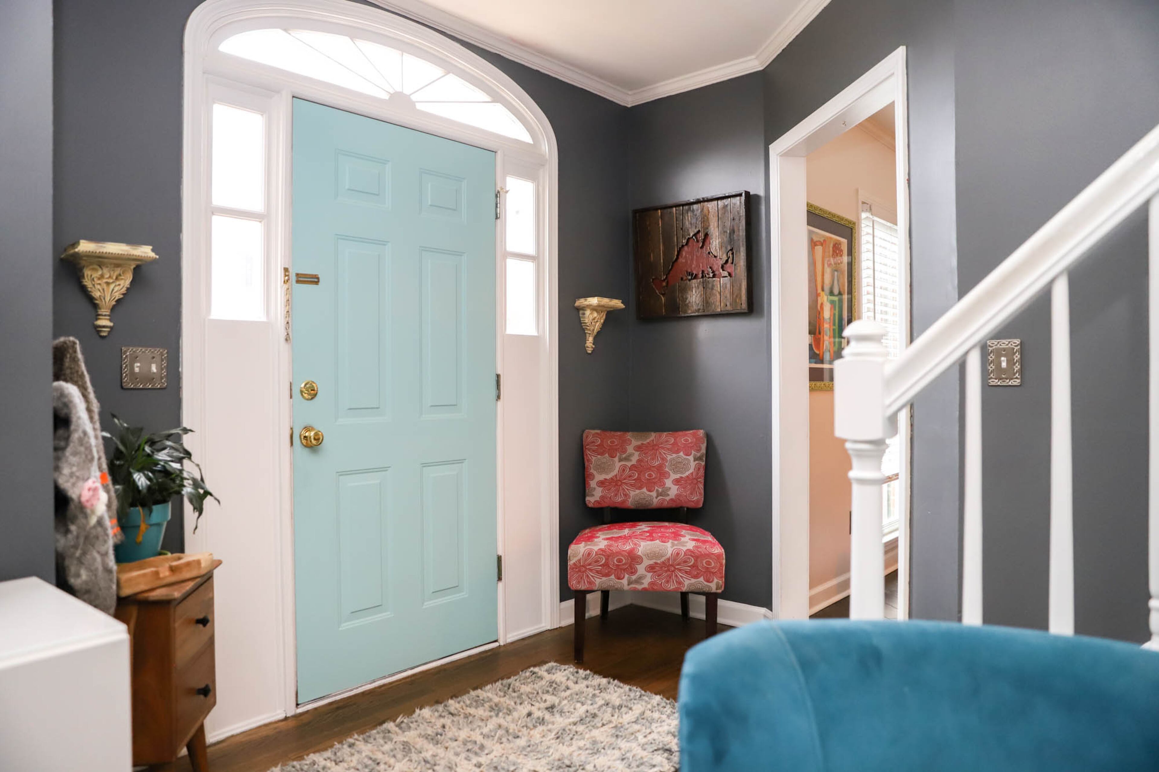 The foyer of Margaret and Michael Fields’ home is open and welcoming. Two vintage style corbels frame the door, and a wooden map of Martha’s Vineyard by local artist Justin Cox hangs by the entrance to the dining room. Text by Shannon Dominy/Photo by Reynolds Rogers