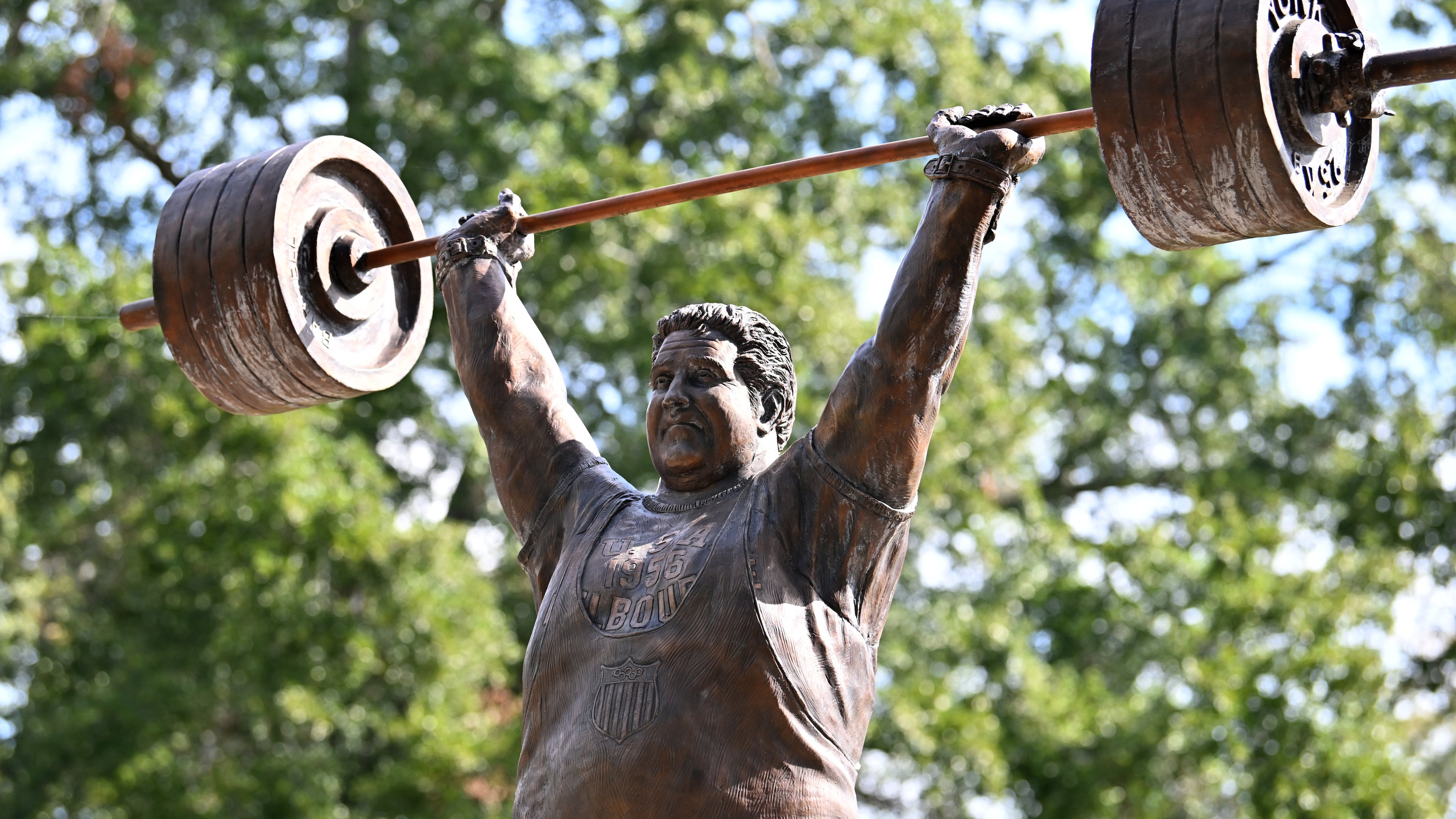 The life-size bronze statue of Paul Anderson in Toccoa, Georgia, took flight after a fourth-grade class wanted to honor "the world's strongest man" in his hometown. (Hyosub Shin/AJC)