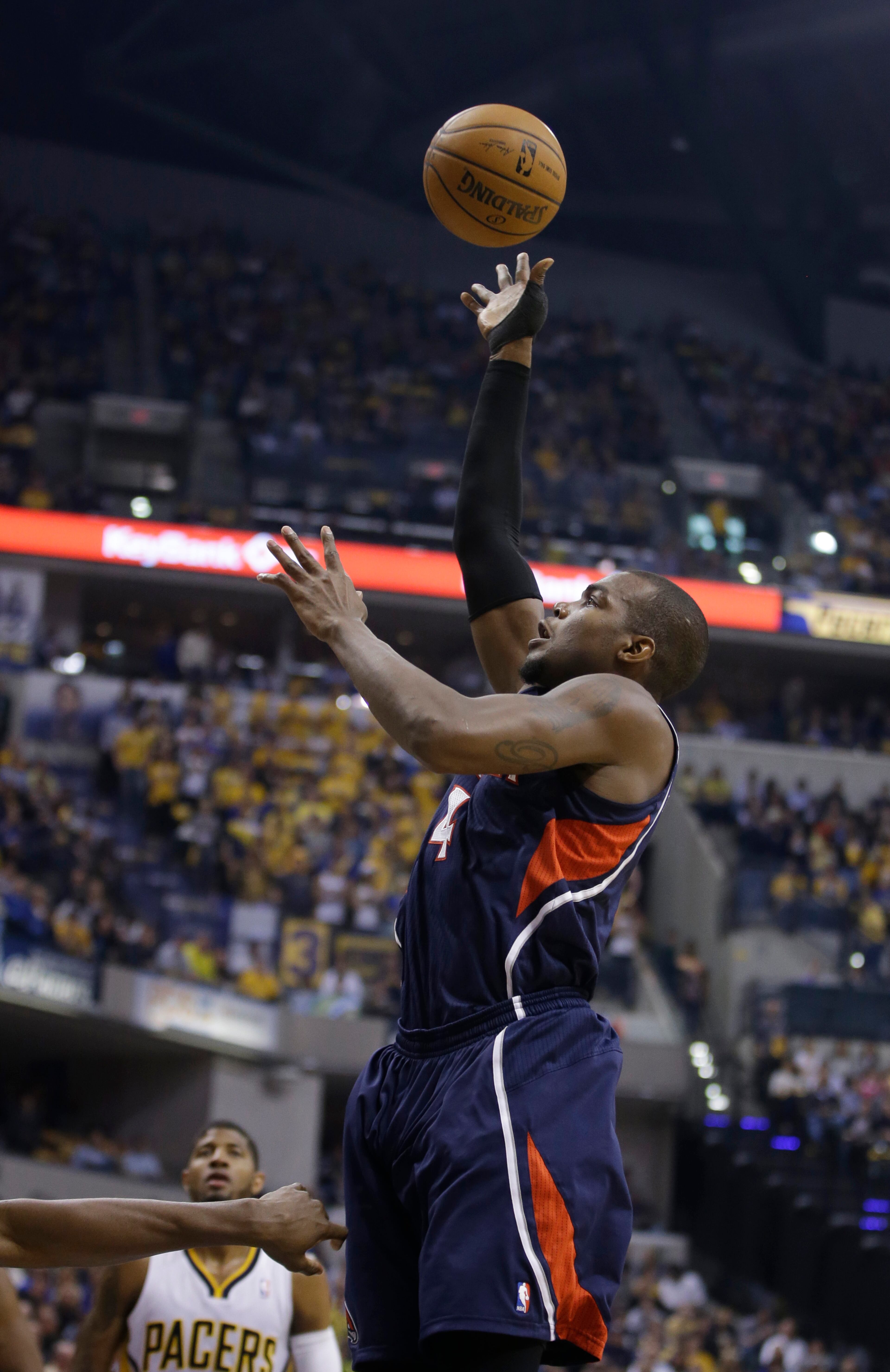 Atlanta Hawks' Paul Millsap puts up a shot during the first half in Game 2 of an opening-round NBA basketball playoff series against the Indiana Pacers Tuesday, April 22, 2014, in Indianapolis. (AP Photo/Darron Cummings)