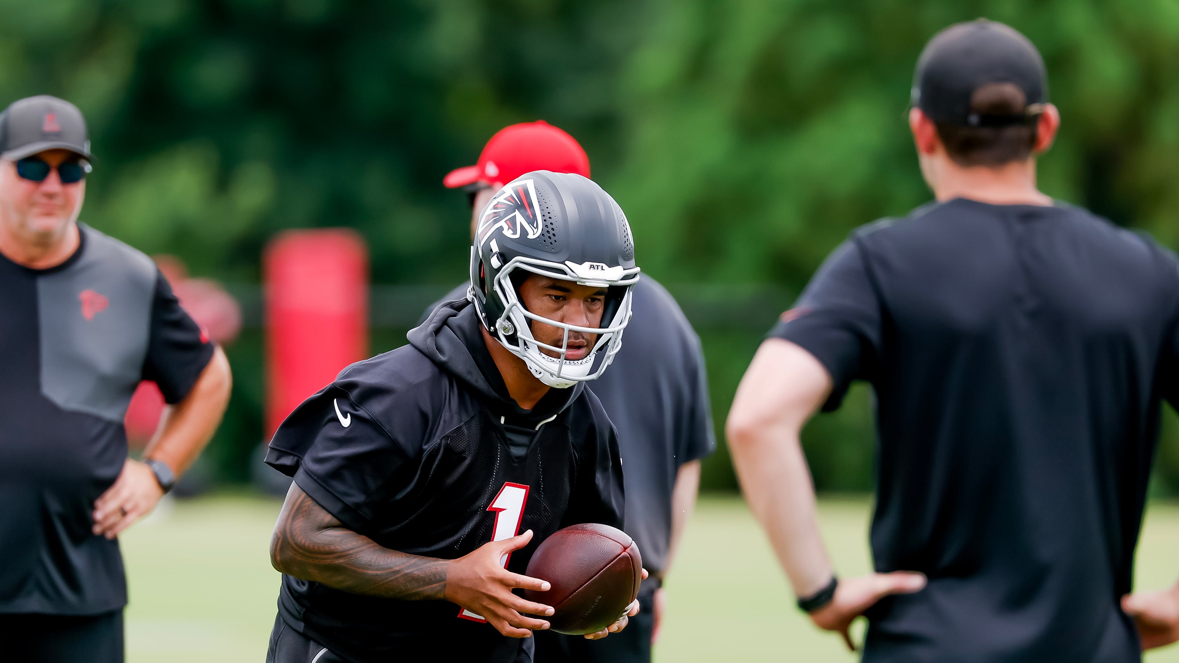 Falcons quarterback Tua Tagovailoa — pictured taking part in practice Monday, June 8, 2026 — says that despite starting over after six seasons with the Dolphins, he's still able to live out the dream he had as a 10-year-old of playing in the NFL. (Erik S. Lesser for the AJC)