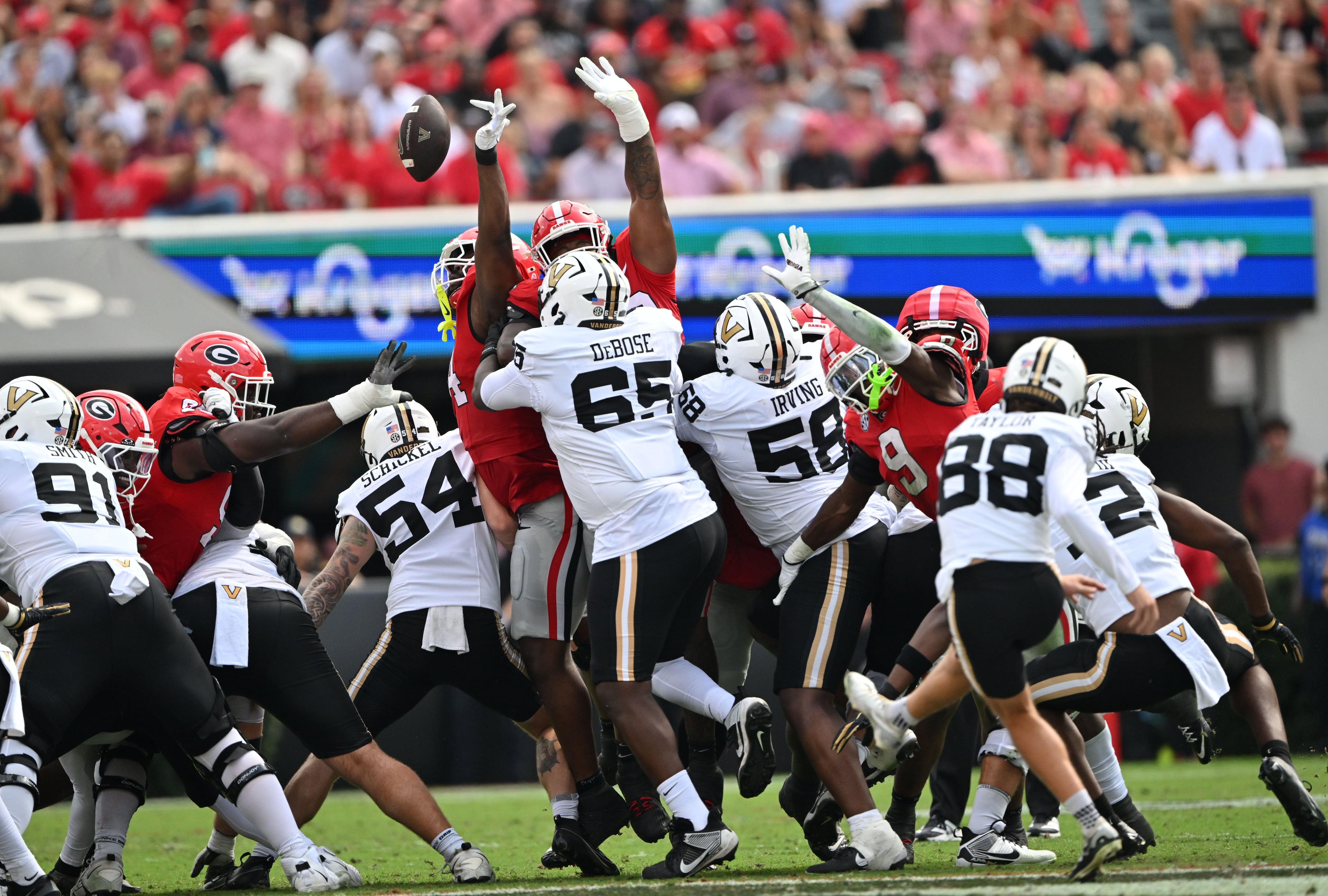 Georgia defensive lineman Jordan Hall (44) blocks the kick by Vanderbilt kicker Brock Taylor (88) during the first half in an NCAA football game at Sanford Stadium on Saturday, Oct. 3, 2026, in Athens. (Hyosub Shin/AJC)