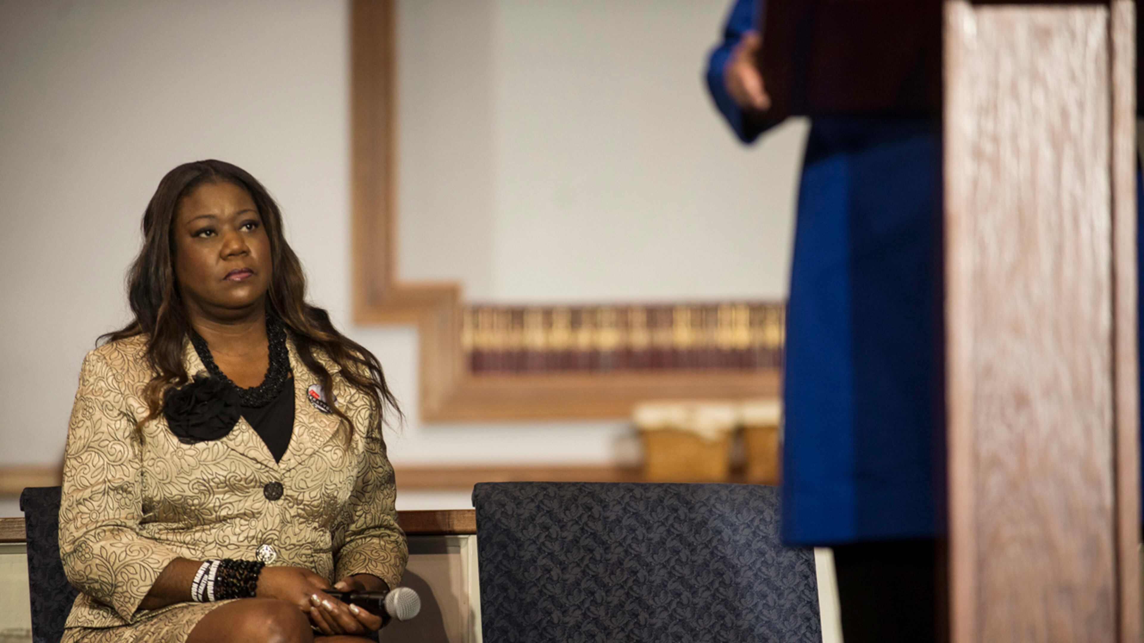 Sybrina Fulton, mother of Trayvon Martin, listens to Hillary Clinton speak at Central Baptist Church in Columbia, S.C., Feb. 23, 2016. Clinton, seeking to cement her lead among black voters, released statements from the mothers of Trayvon Martin and Jordan Davis on Tuesday criticizing Bernie Sanders for saying white people “don’t know what it’s like to be living in a ghetto.”