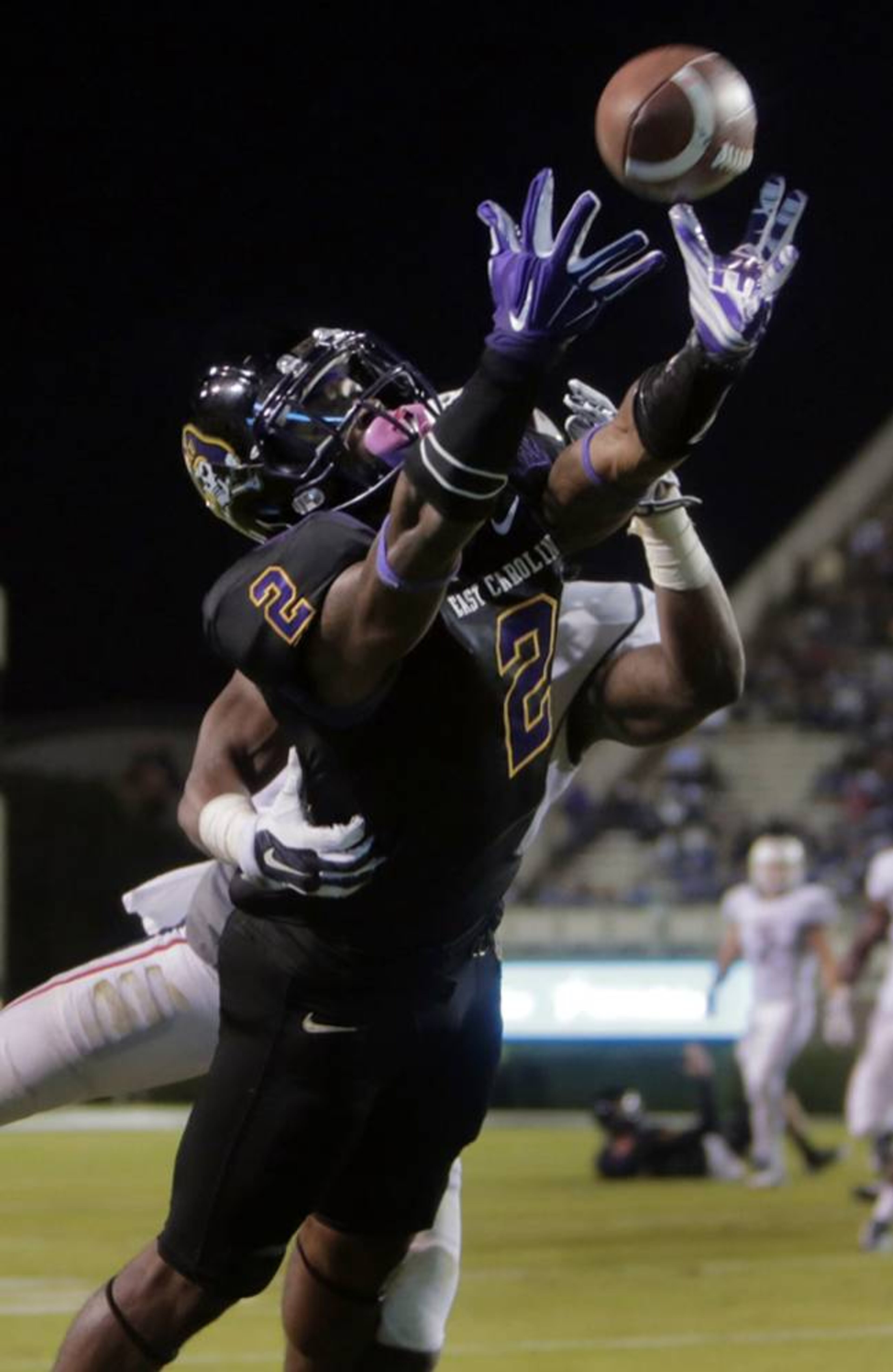 FILE - In this Oct. 23, 2014, file photo, East Carolina's Justin Hardy (2) catches a touchdown pass ahead of Connecticut's Jhavon Williams during an NCAA college football game in Greenville, N.C. Hardy is close to completing a remarkable climb at East Carolina: from walk-on receiver to the all-time receptions leader in the Football Bowl Subdivision. (AP Photo/Ted Richardson, File) FILE - In this Oct. 23, 2014, file photo, East Carolina's Justin Hardy (2) catches a touchdown pass ahead of Connecticut's Jhavon Williams during an NCAA college football game in Greenville, N.C. Hardy is close to completing a remarkable climb at East Carolina: from walk-on receiver to the all-time receptions leader in the Football Bowl Subdivision. (AP Photo/Ted Richardson, File)