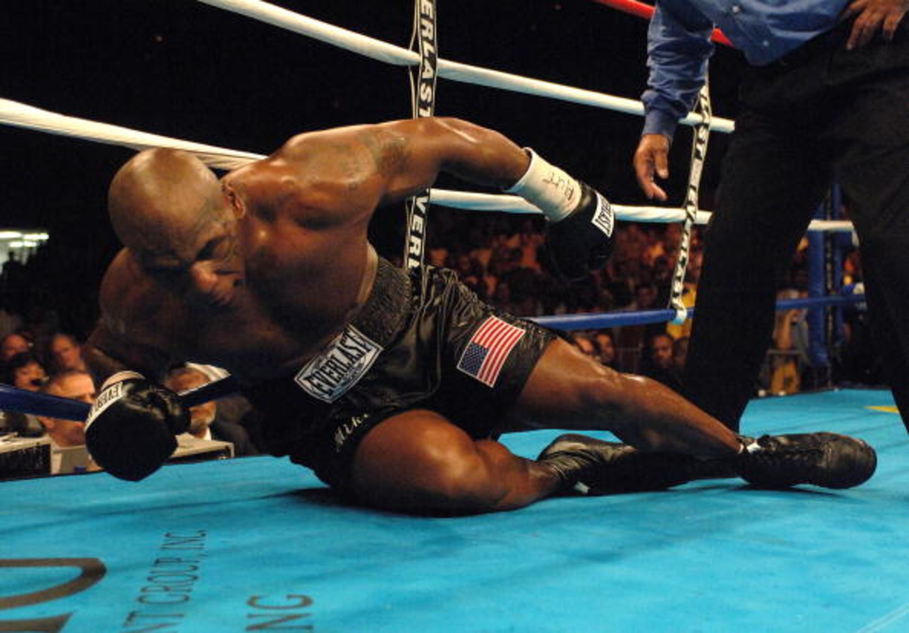 WASHINGTON - JUNE 11: Mike Tyson struggles to get off the canvas after being knocked down by Kevin McBride during their heavyweight bout at the MCI Center June 11, 2005 in Washington, DC. (Photo by Mitchell Layton/Getty Images)