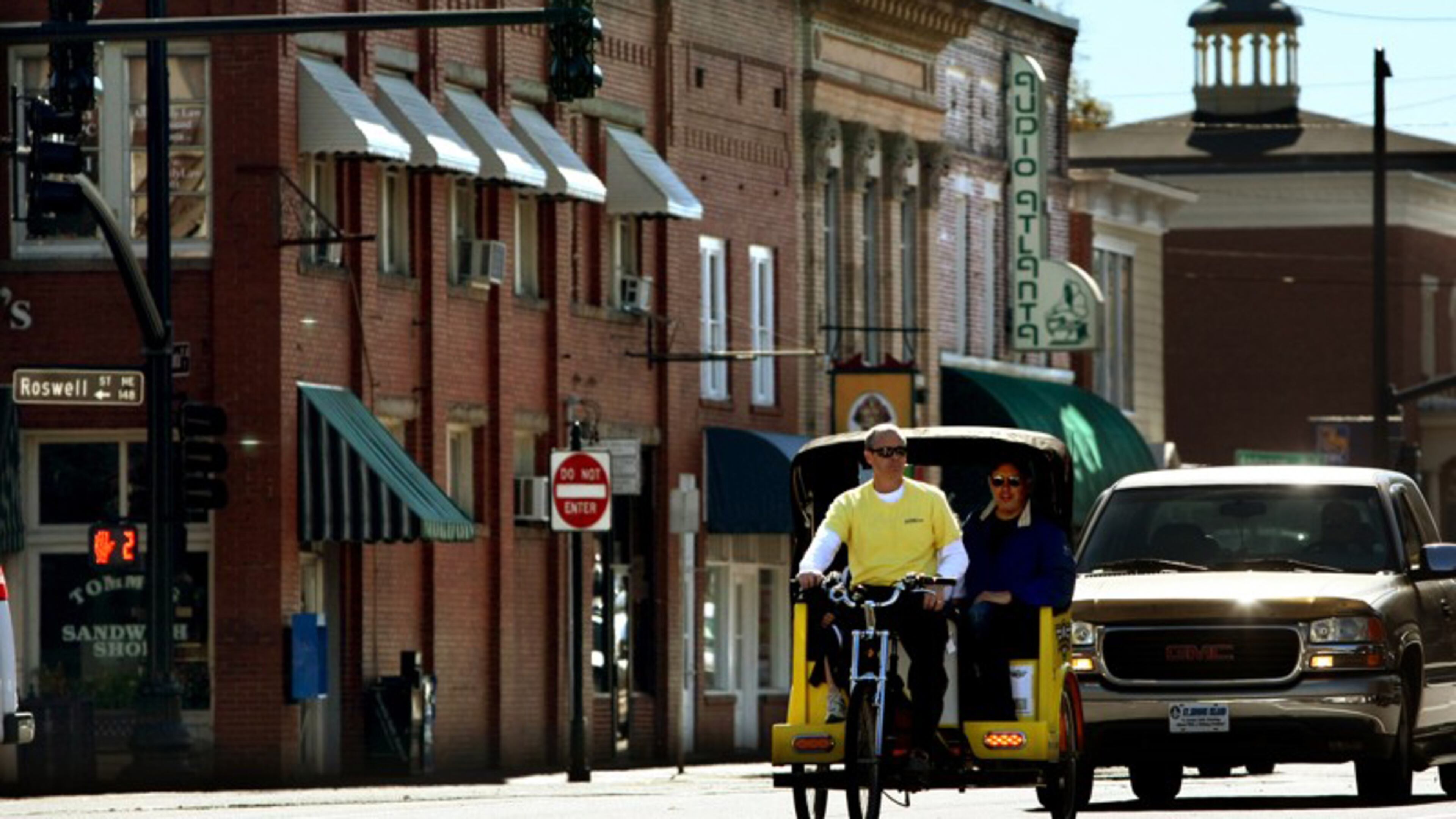 Woodstock has adopted an ordinance and regulations covering pedicabs, such as this one pictured in Marietta. AJC FILE