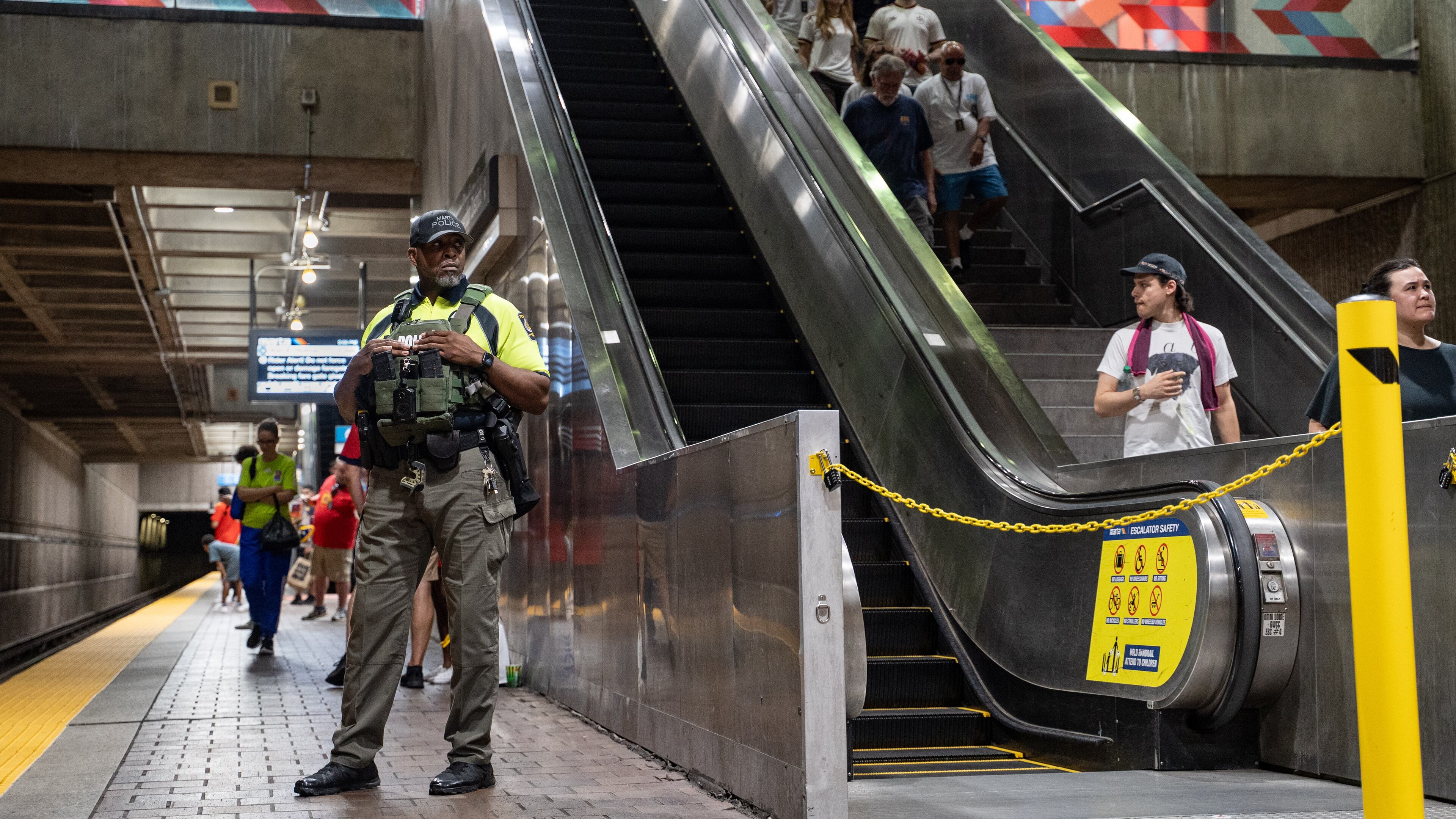 A MARTA Police officer stands on the platform of the SEC District MARTA station as fans attend the first FIFA match held in Atlanta on Monday, June 15, 2026. Recent violence on trains, including a stabbing, heightened safety concerns. (Ben Hendren for the AJC)