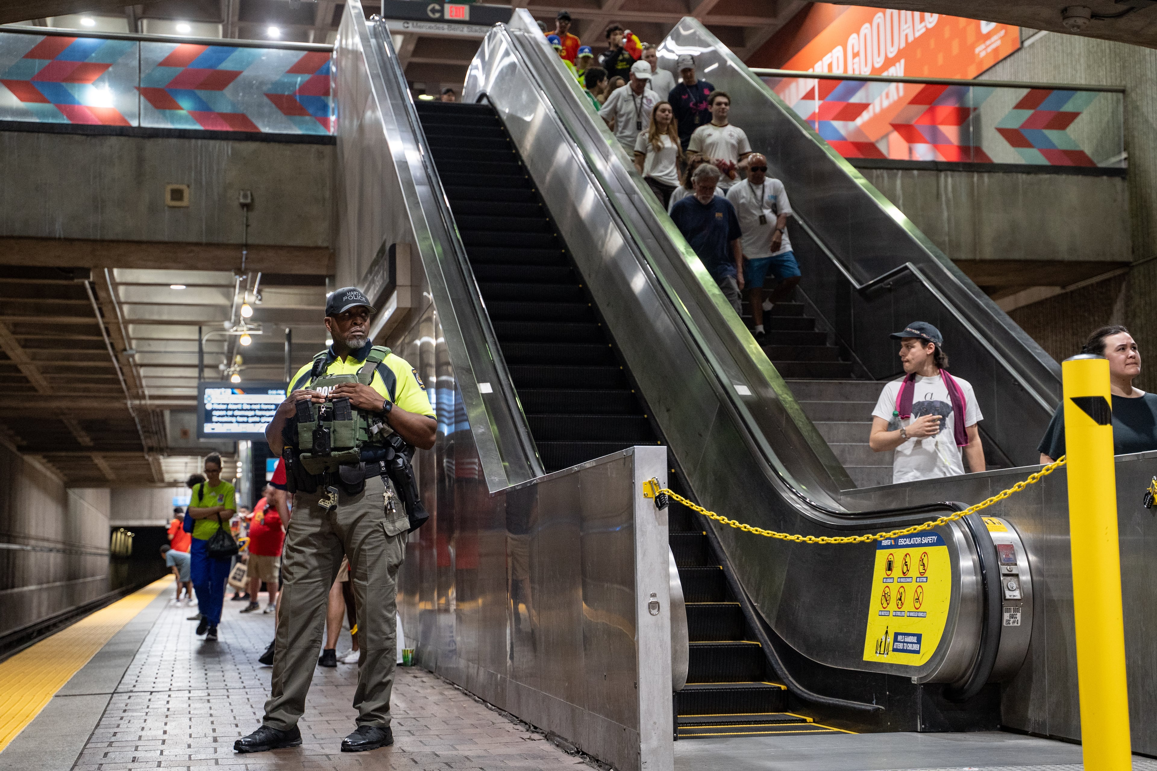 A MARTA Police officer stands on the platform of the SEC District MARTA station last week. (Ben Hendren for the AJC)