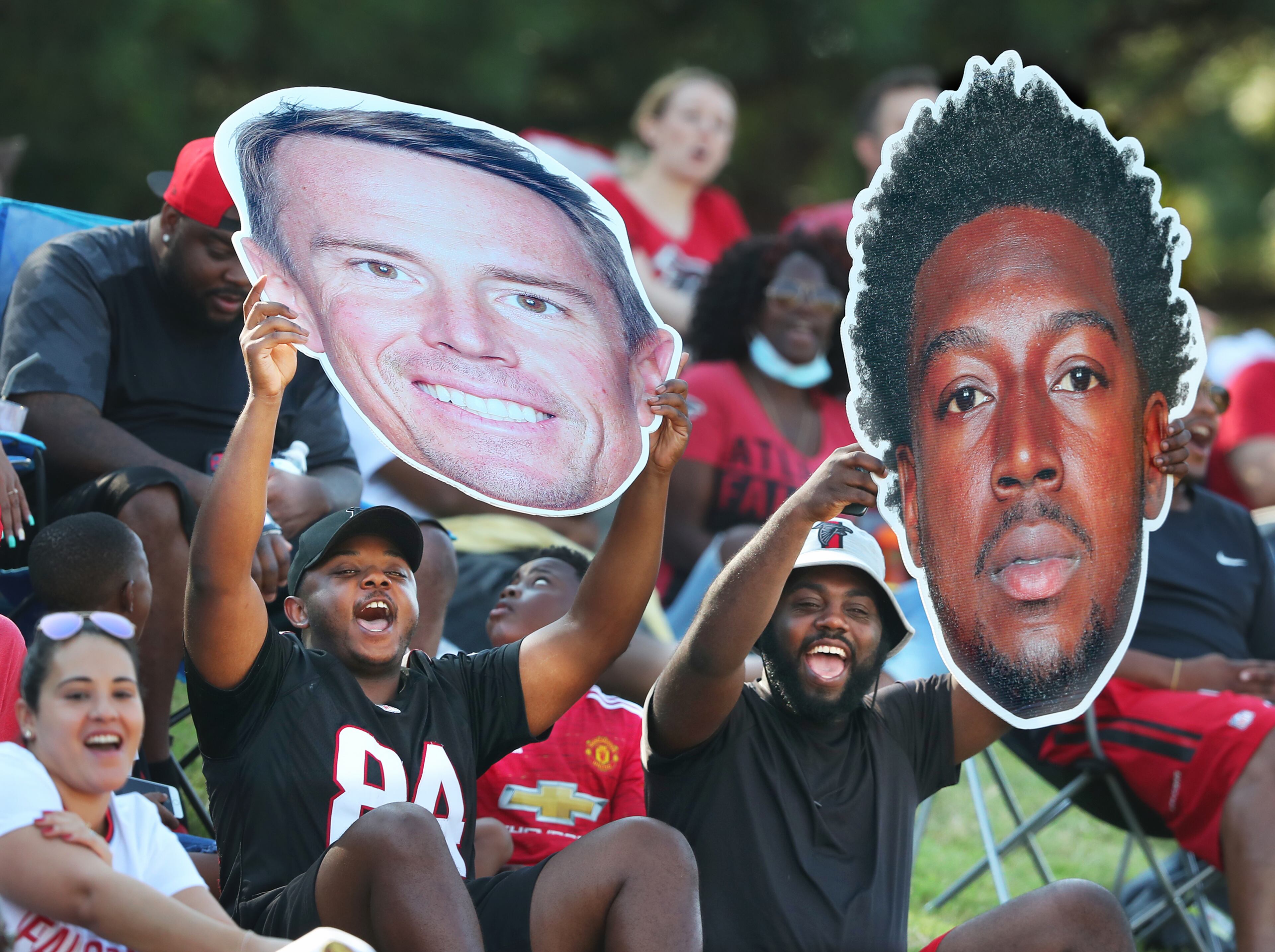 Falcons fans cheer for Matt Ryan and Calvin Ridley from the hill overlooking the practice fields during the fourth day of training camp practice Sunday, Aug. 1, 2021, in Flowery Branch. (Curtis Compton / Curtis.Compton@ajc.com)