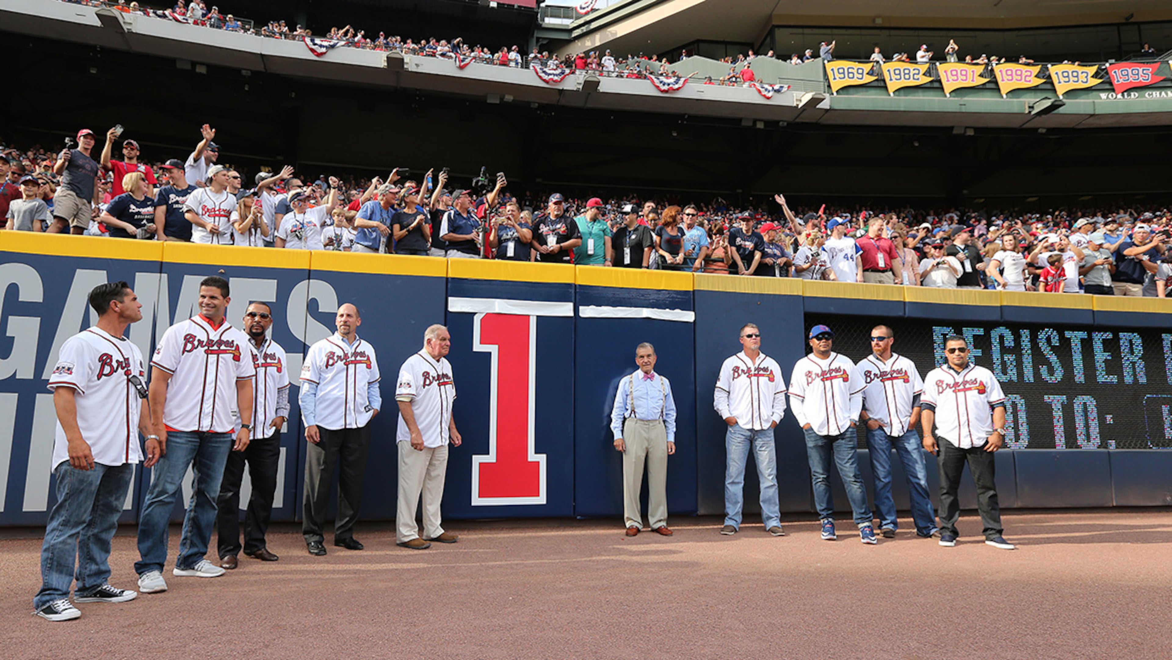 October 02, 2016 Atlanta: Braves Hall of Fame manager Bobby Cox, Braves president John Scherholtz, and former Braves players prepare to tear down the final number during the final game at Turner Field on Sunday, Oct. 2, 2016, in Atlanta. The team will move to a new stadium in Cobb County for the 2017 season. Curtis Compton /ccompton@ajc.com
