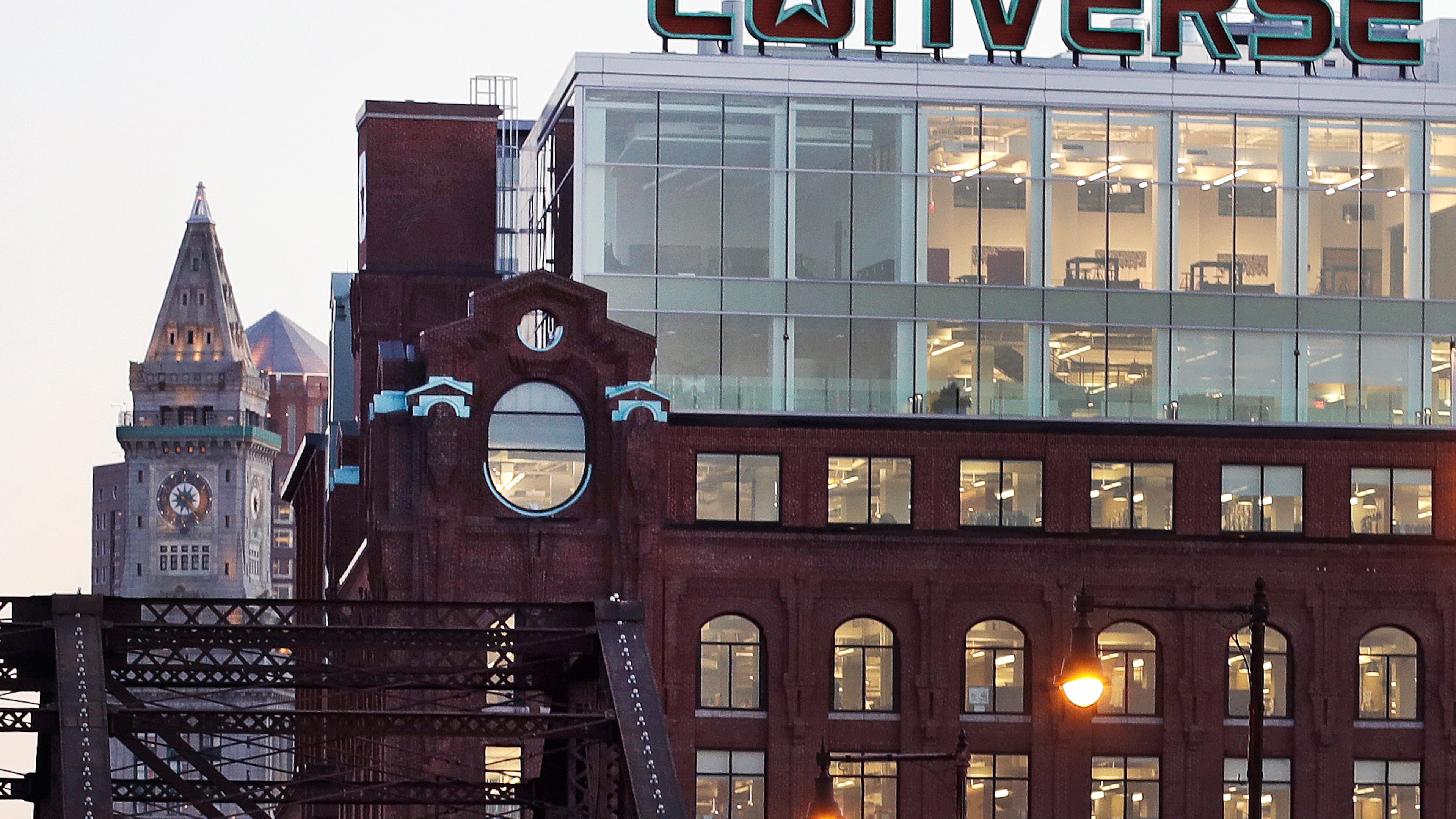 FILE - The Converse logo is displayed on the roof of the company's world headquarters in the West End neighborhood of Boston, Wednesday, Dec. 28, 2016. (AP Photo/Charles Krupa, file)
