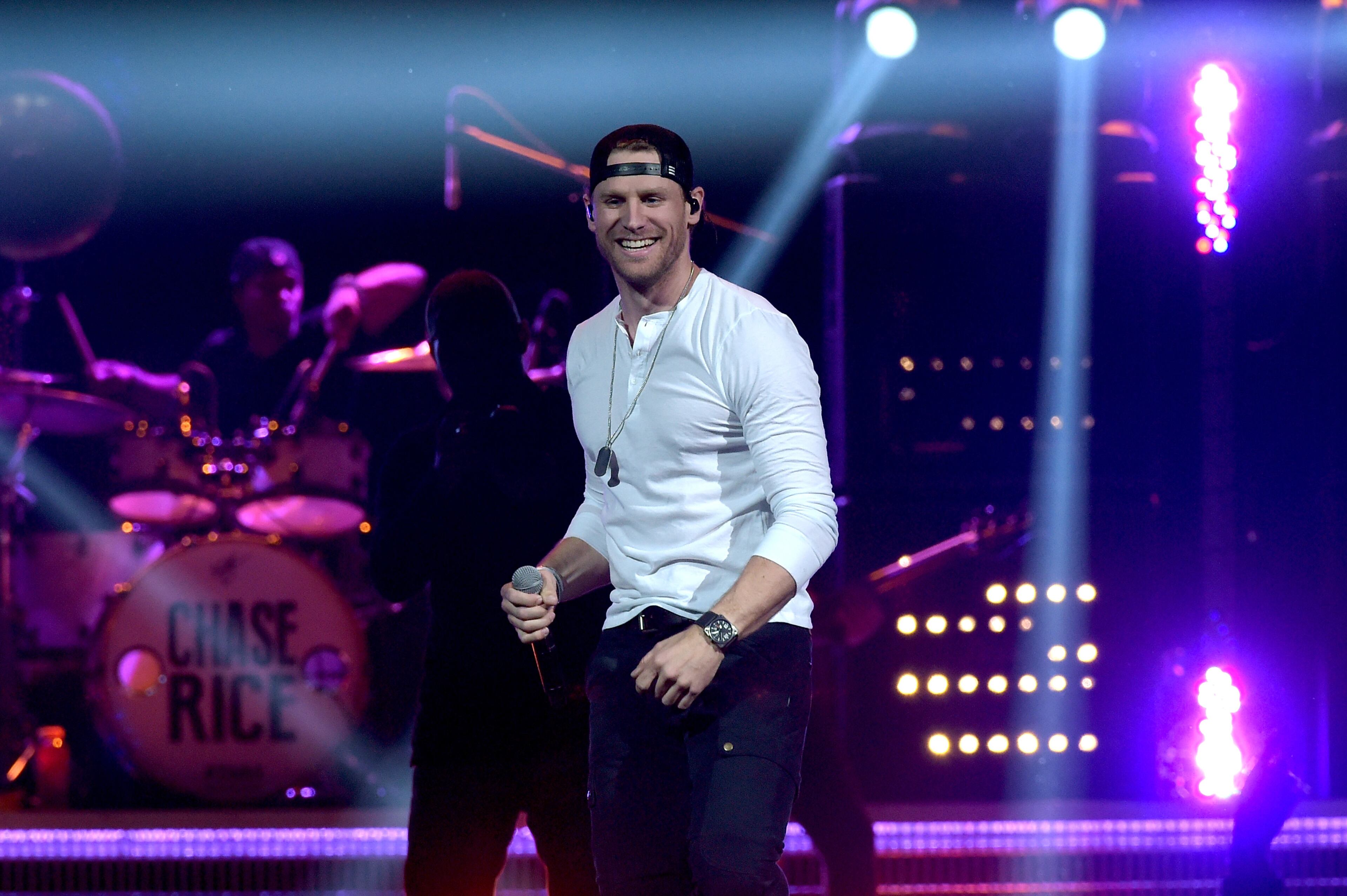 NASHVILLE, TN - MARCH 26: (EXCLUSIVE ACCESS, SPECIAL RATES APPLY) Singer-songwriter Chase Rice performs onstage during Kenny Chesney's The Big Revival 2015 Tour kick-off for a 55 show run through August. The high-energy opening night included 2 ½ hours of music, including five songs from his #1 The Big Revival, surprise guests, a leaner, cleaner stage and 2.3 million pixel screen that gave the sold out house the best view theyve ever had of the 8-time Entertainer of the Year at the Bridgestone Arena on March 26, 2015 in Nashville, Tennessee (Photo by Rick Diamond/Getty Images for Kenny Chesney)