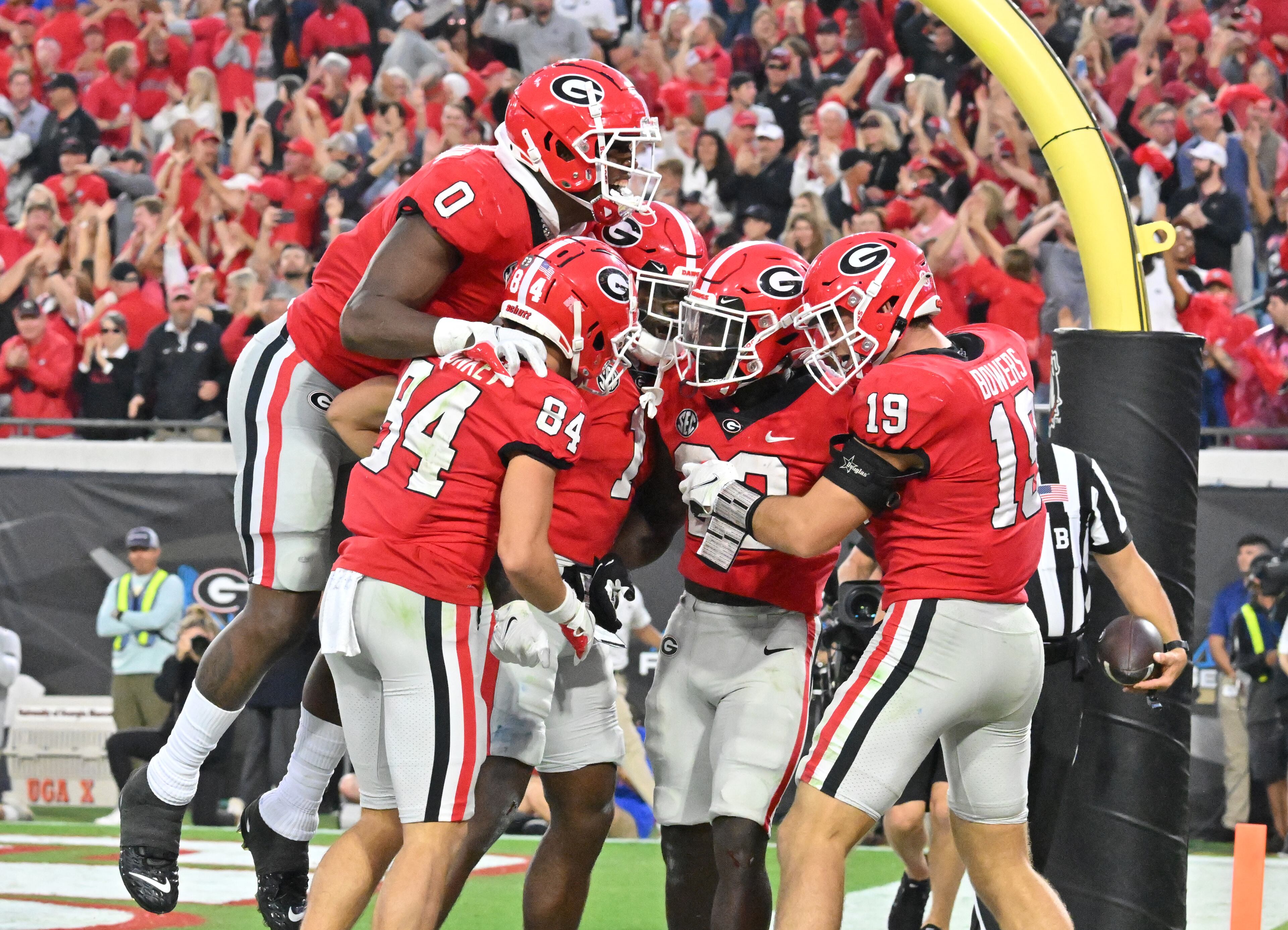 Georgia's running back Daijun Edwards (30) celebrates with teammates after scoring a touchdown during the second half. (Hyosub Shin / Hyosub.Shin@ajc.com)