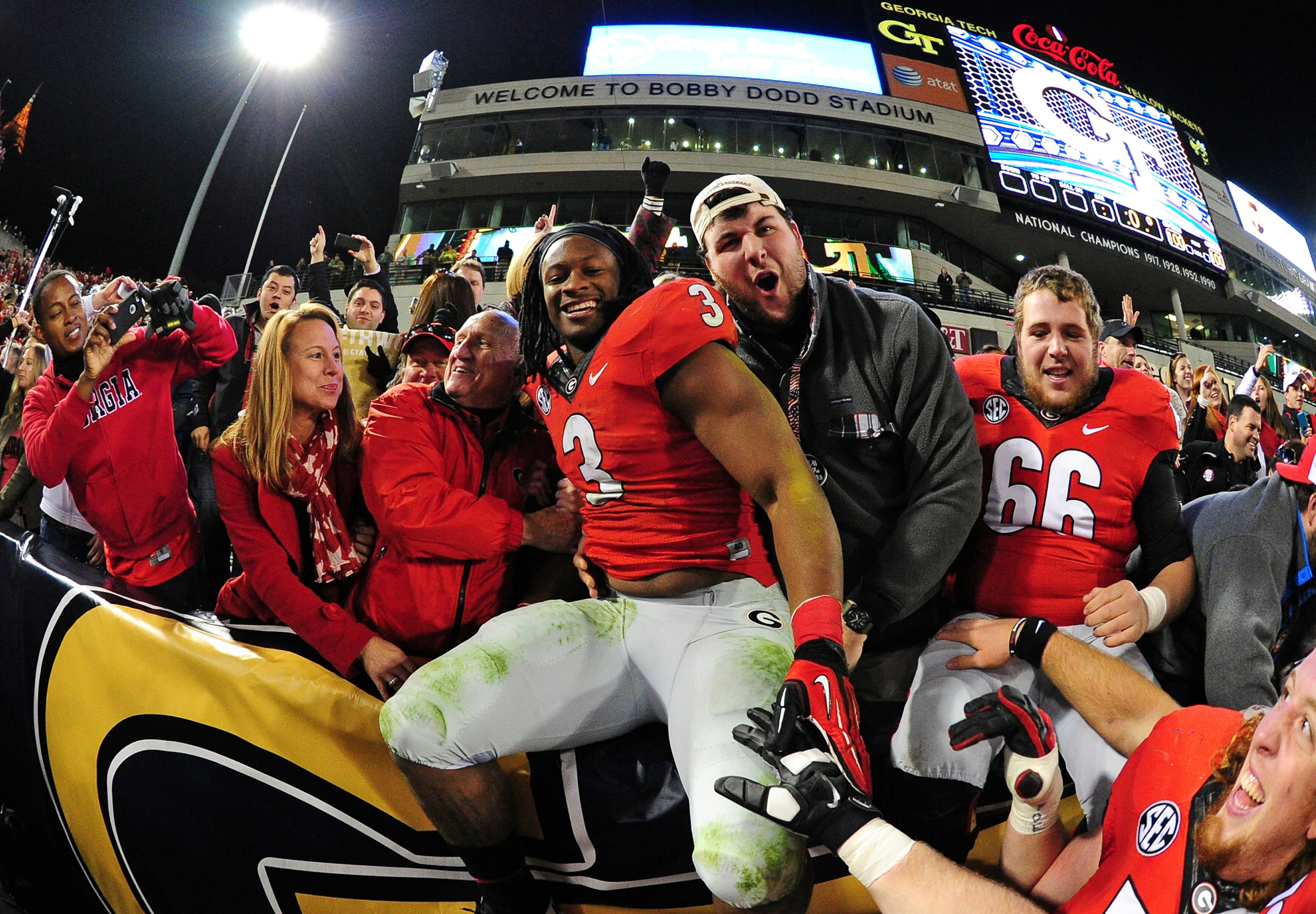 Todd Gurley celebrates with fans after the game against Georgia Tech at Bobby Dodd Stadium on Nov. 30, 2013. (Photo by Scott Cunningham/Getty Images)