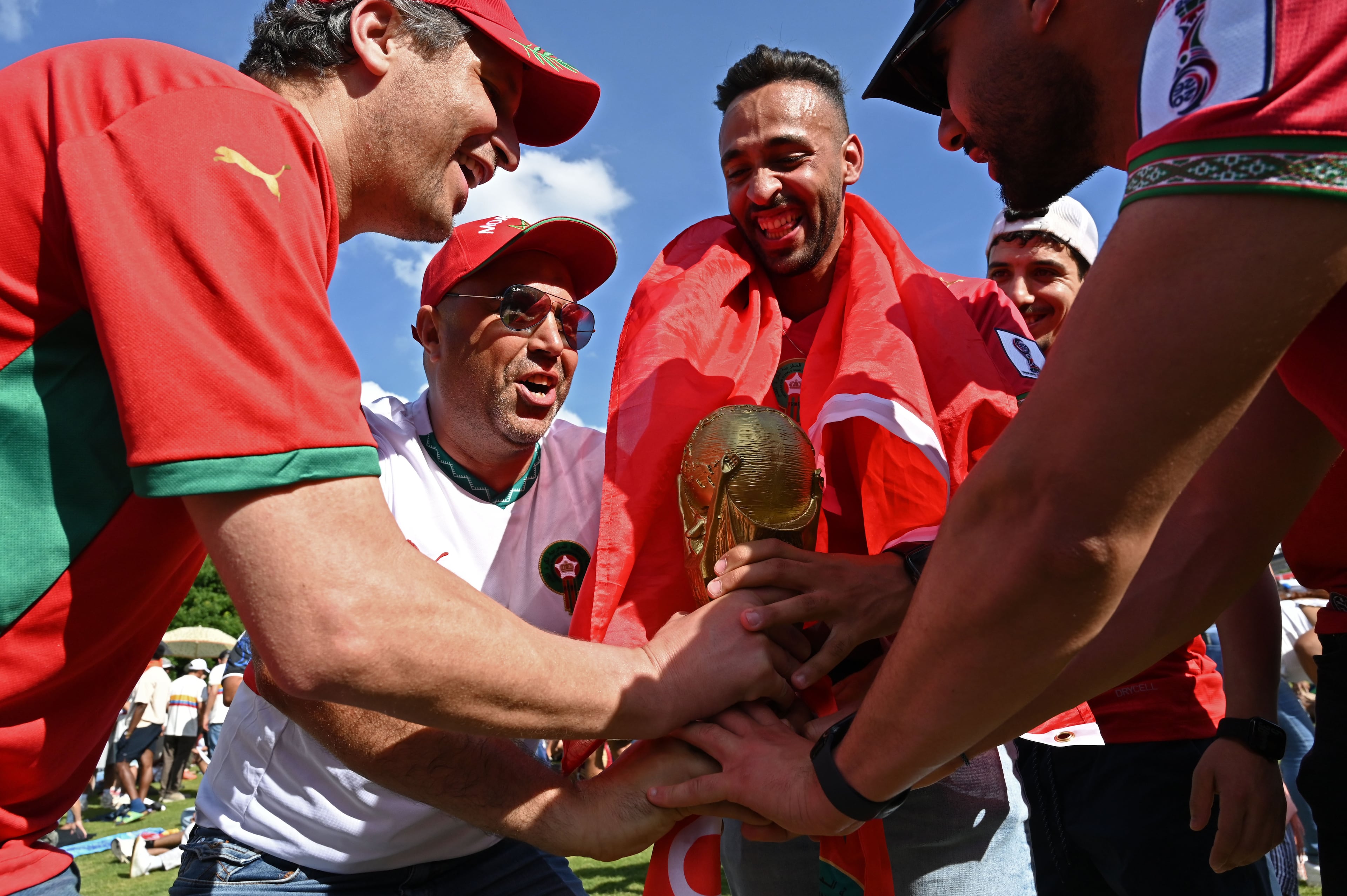 Local Moroccan fans, including (from left) Chakib Assif and Elmamoune Fakri, cheer as they gather for a watch party ahead of the match against Brazil at the FIFA Fan Festival in Centennial Olympic Park on Saturday, June 13, 2026, in Atlanta. (Hyosub Shin/AJC)