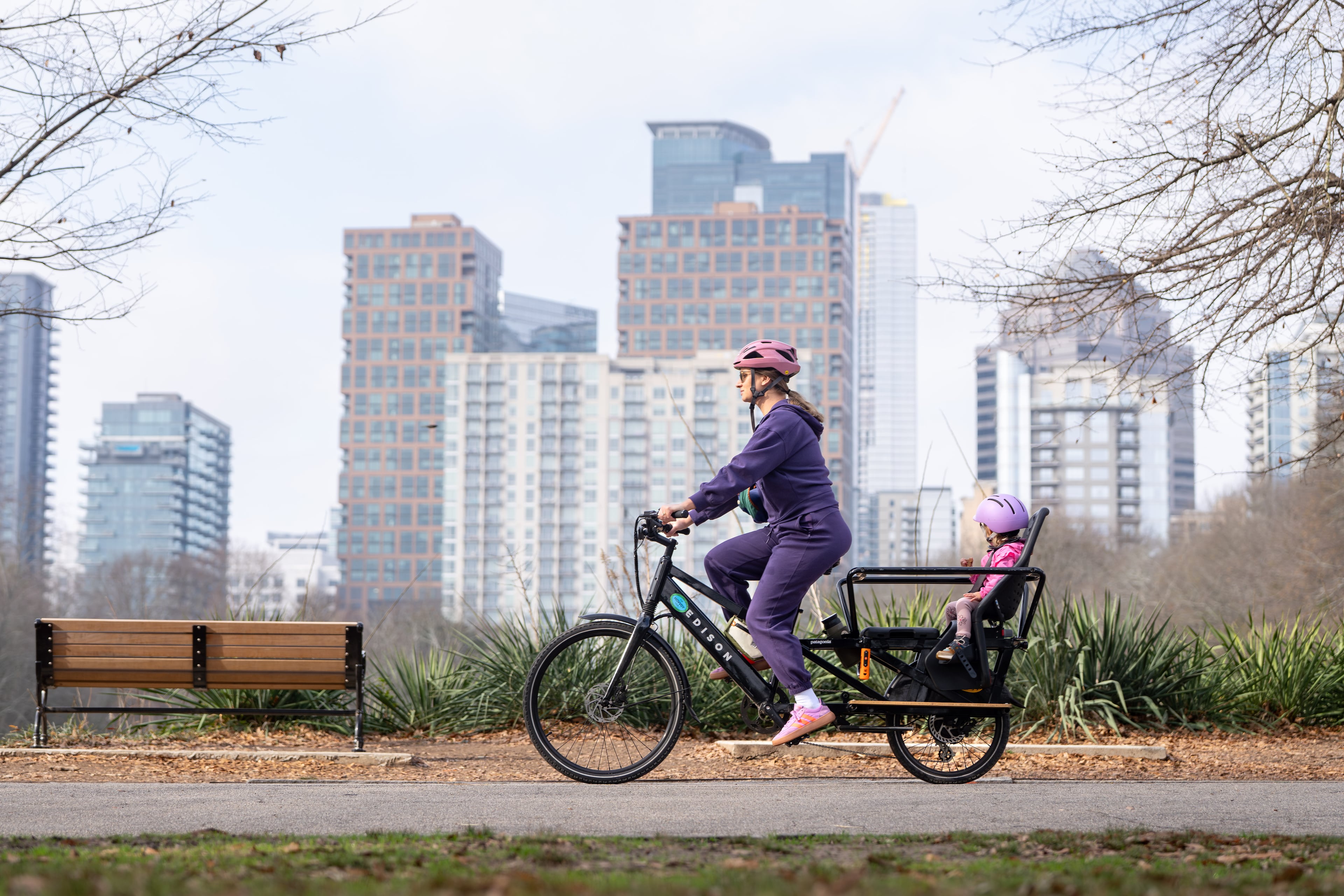 A mother and daughter ride an e-bike through Piedmont Park in Atlanta on Wednesday, Jan 7, 2026. (Ben Hendren for the AJC)