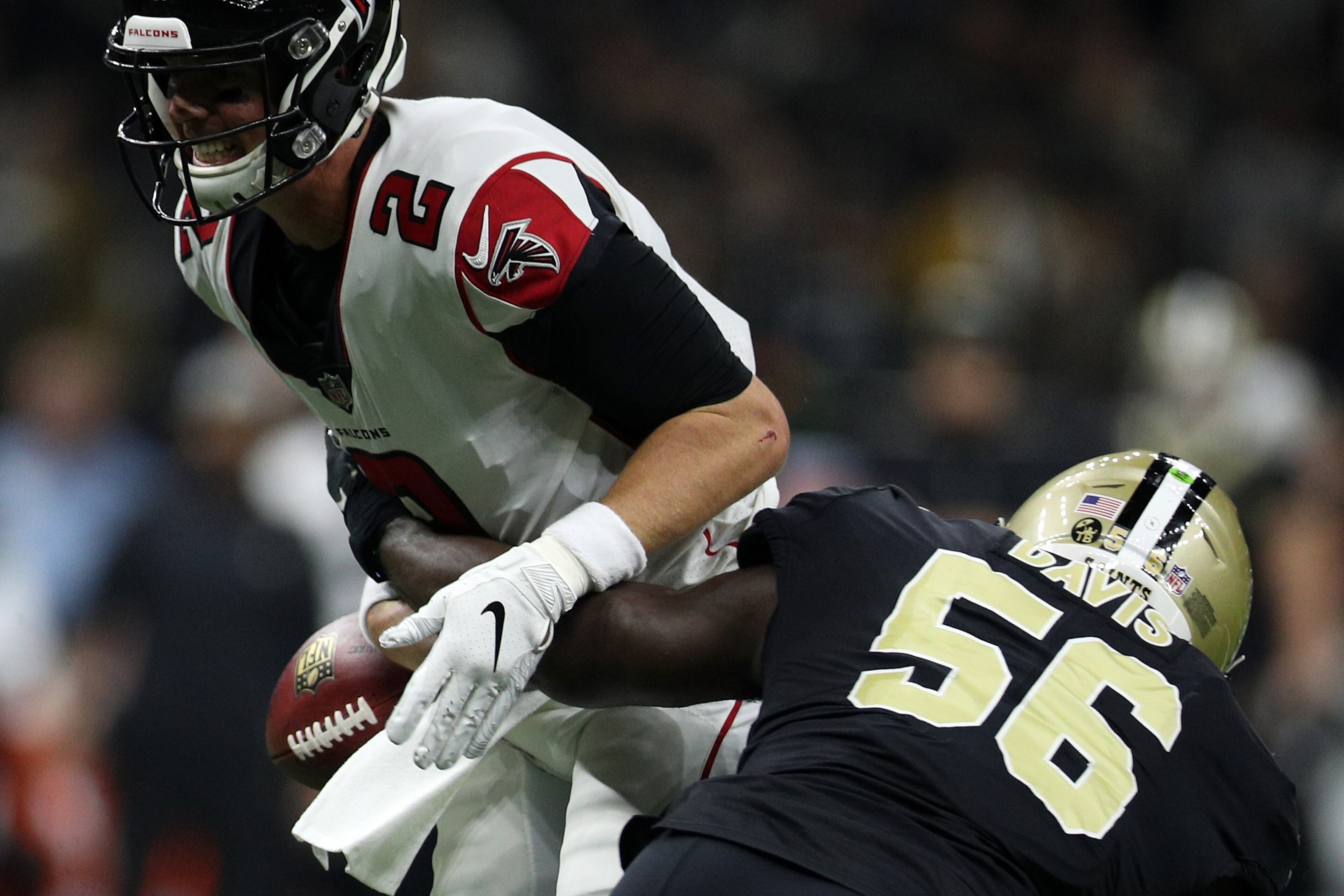 NEW ORLEANS, LA - NOVEMBER 22: Matt Ryan #2 of the Atlanta Falcons fumbles the ball after a tackle by Demario Davis #56 of the New Orleans Saints at the Mercedes-Benz Superdome on November 22, 2018 in New Orleans, Louisiana. (Photo by Chris Graythen/Getty Images)