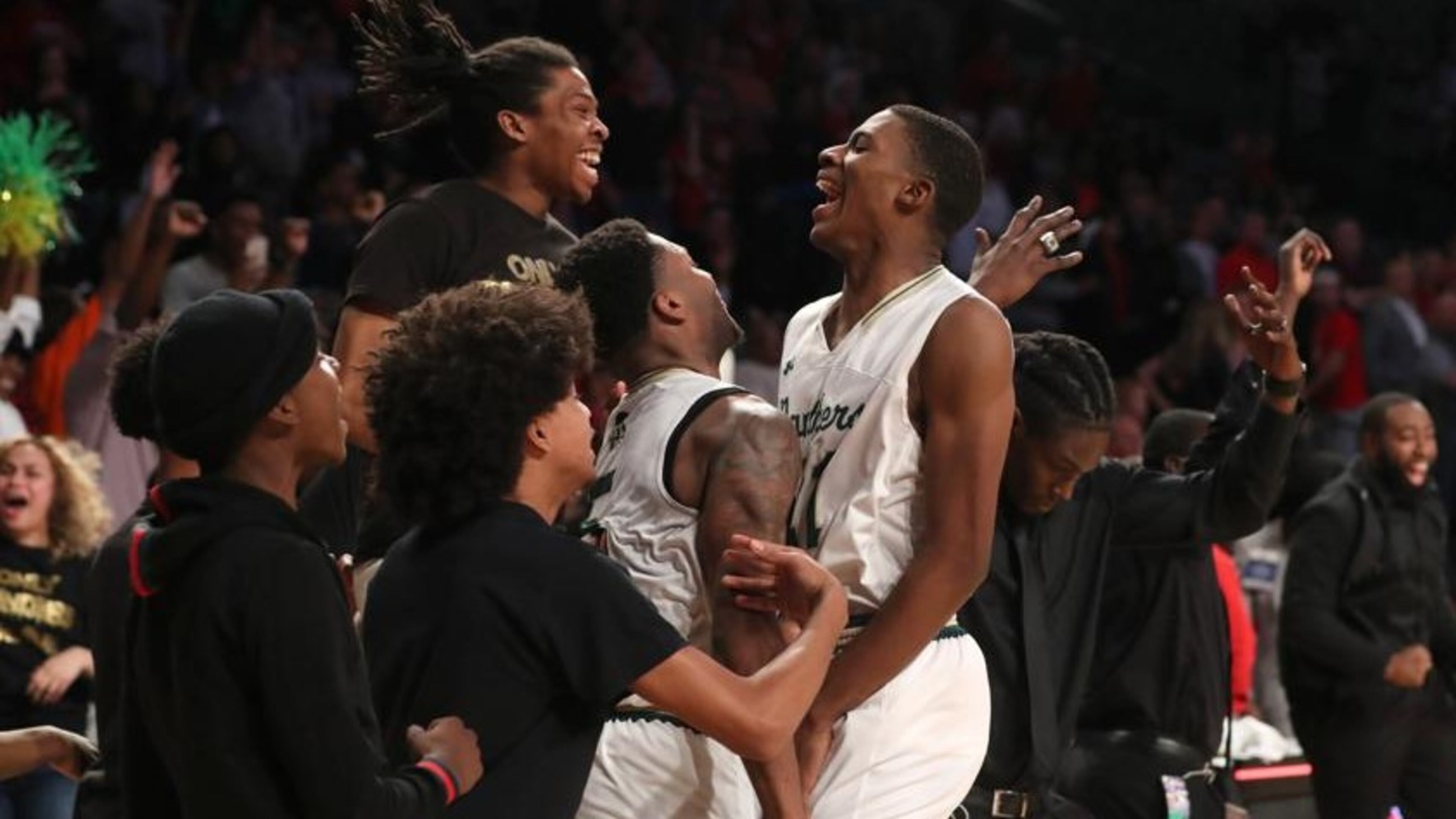 March 9, 2018 - Atlanta, Ga: Hughes guard Landers Nolley (21, center) celebrates with teammates after they defeated Gainesville during the GHSA Class AAAAAA Boys State Championship at McCamish Pavilion Friday, March 9, 2018, in Atlanta. Hughes won 85-78.