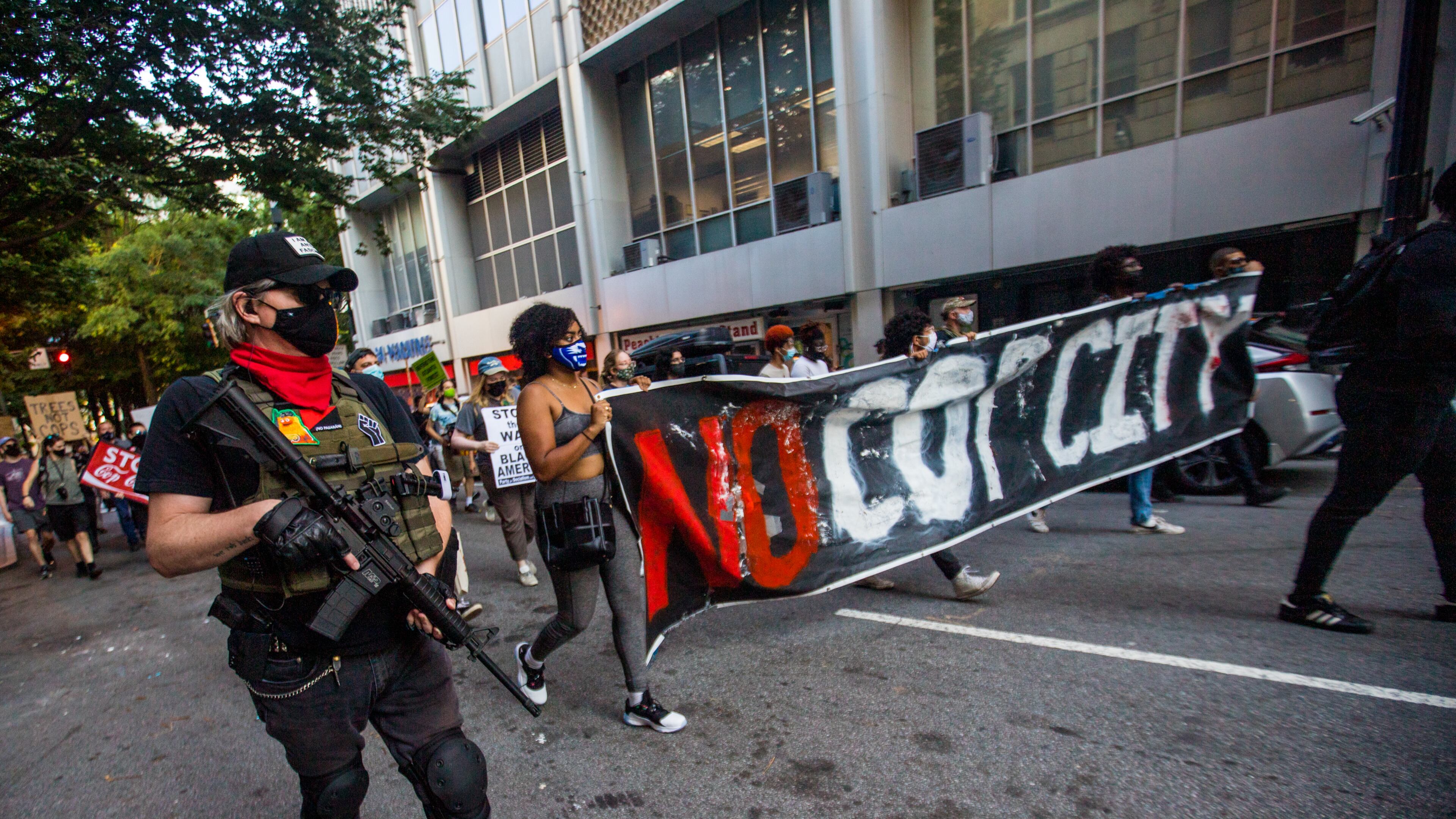 Protesters march through downtown Atlanta in September 2021 to demonstrate against the police training facility being built in unincorporated DeKalb County.
(Jenni Girtman for The Atlanta Journal-Constitution)