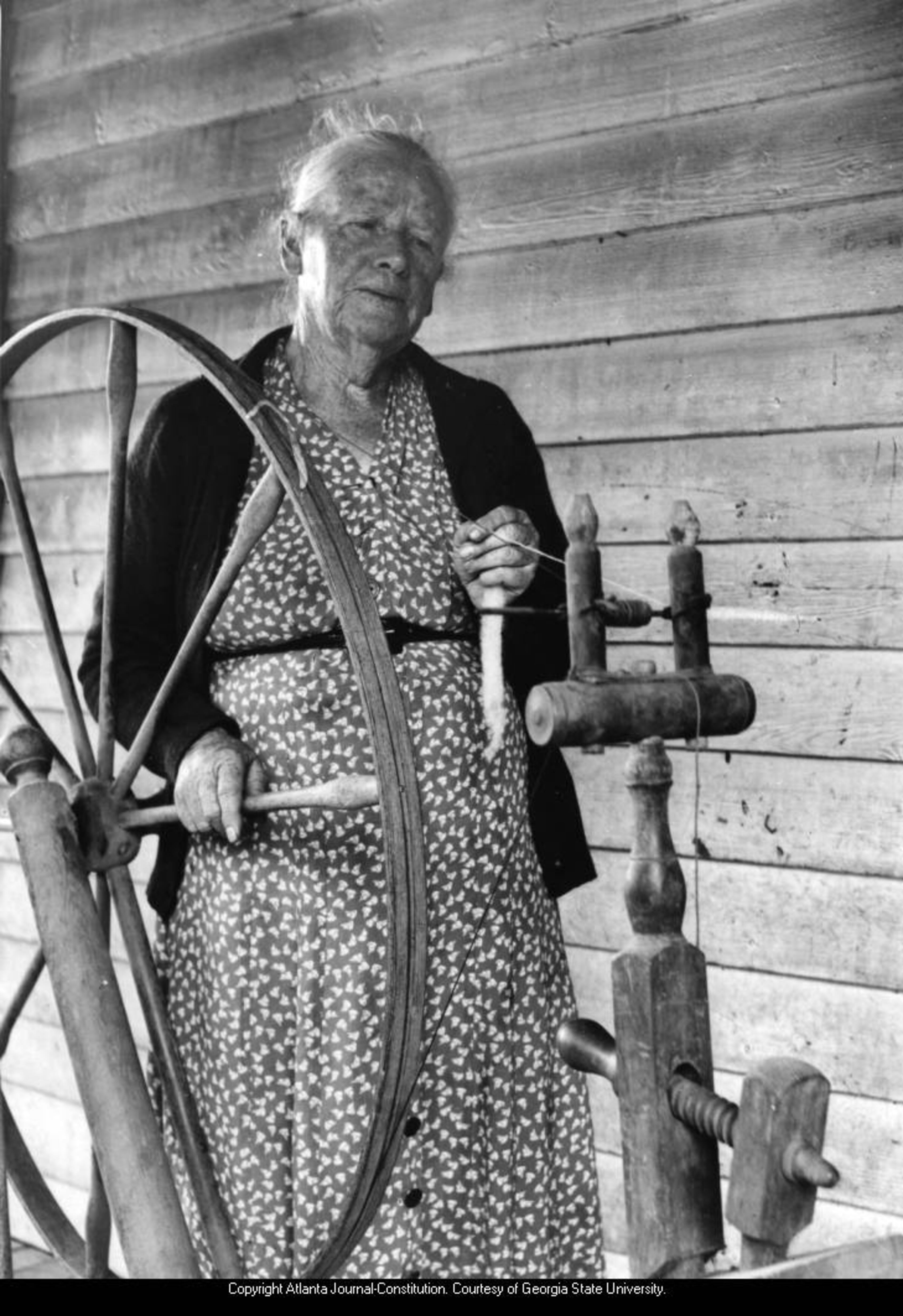 Aunt Fanny Smith spins wool by hand, Georgia mountains, ca. 1930s; 1940s.