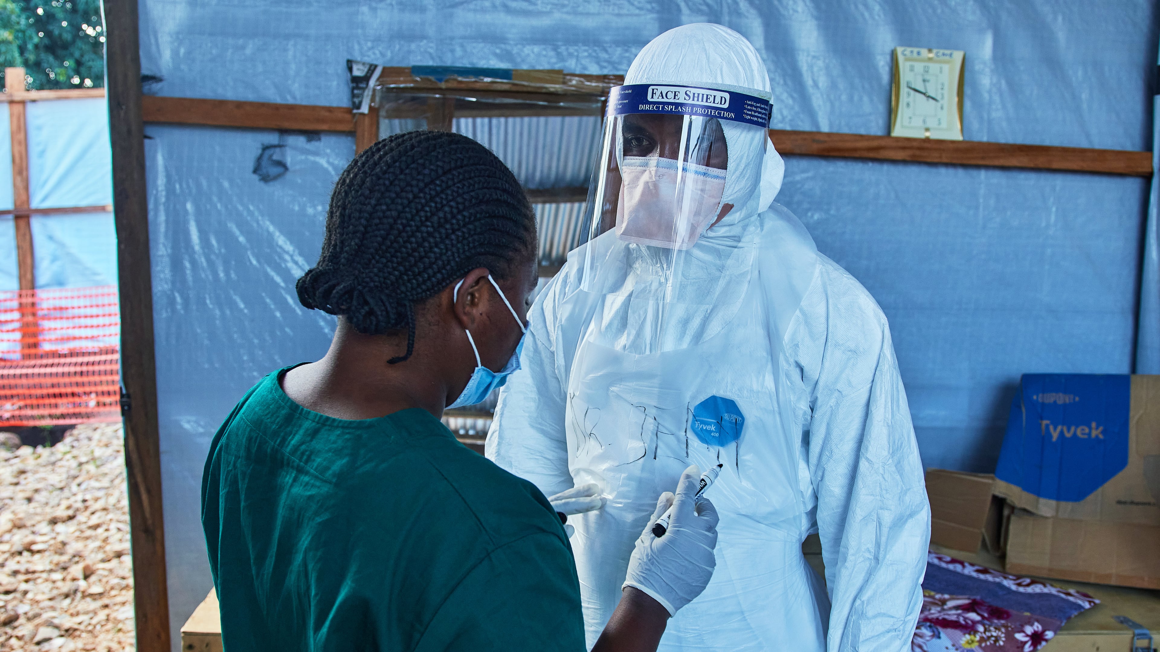 Health workers interact at the Evangelical Medical Center, in Bunia, eastern Congo, Friday, July 3, 2026, where Ebola clinical trials are scheduled to take place. (AP Photo/Dirole Lotsima Dieudonne)