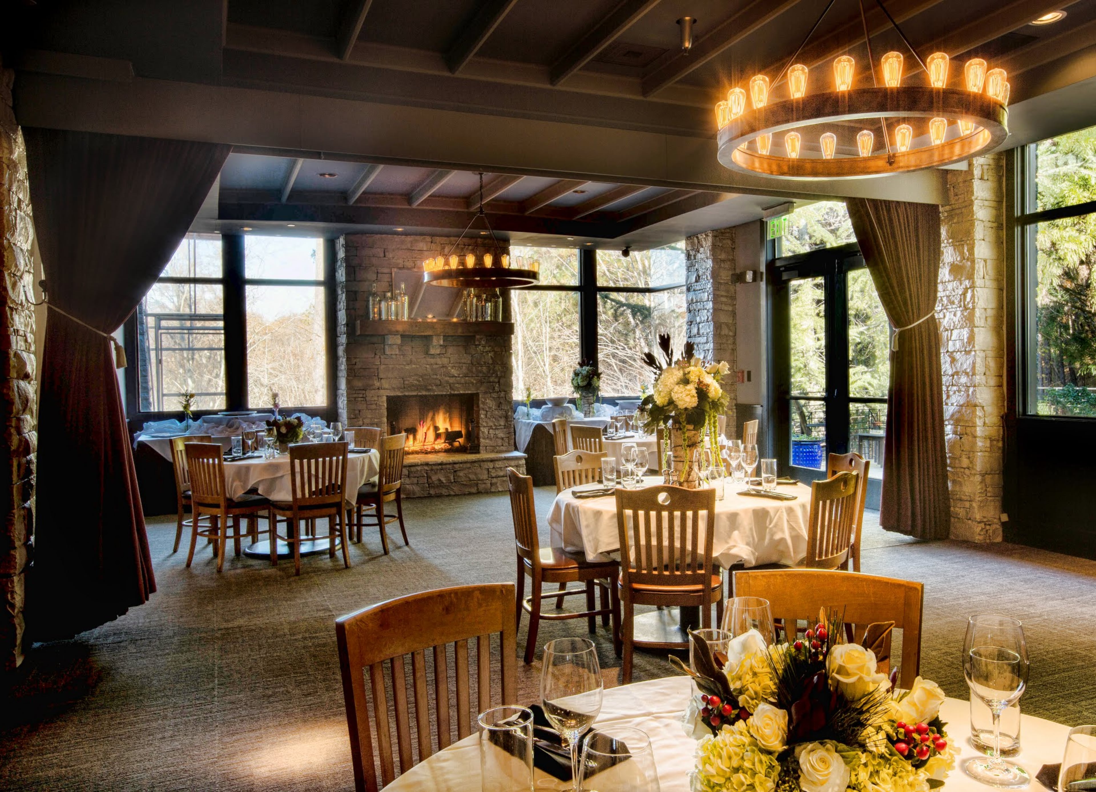 Branches and stacked stone help to provide a cushy, snug interior with fireside dining at Ray's at Killer Creek.